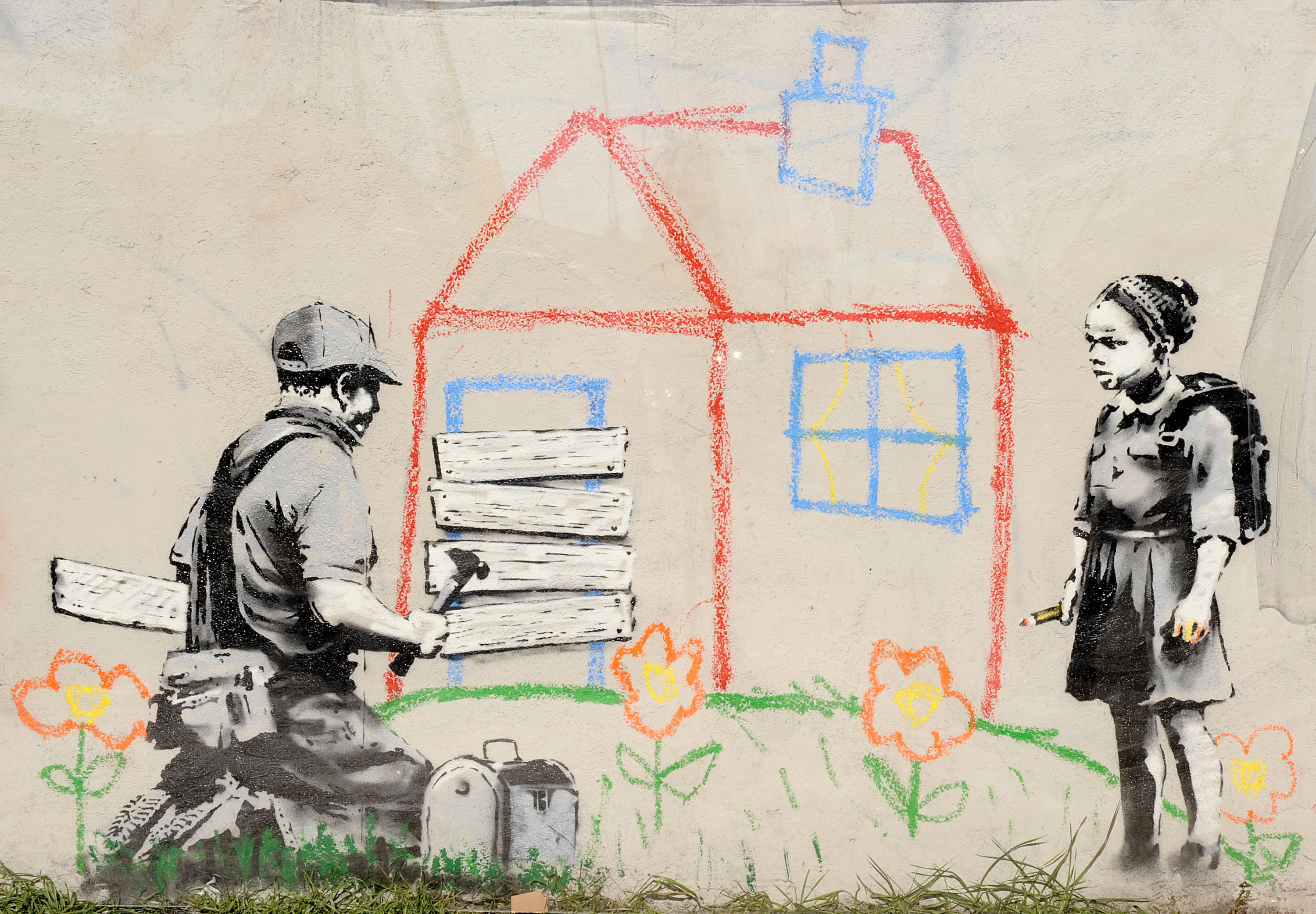 A new artwork, "Crayon Foreclosure," attributed to guerrilla graffiti artist Banksy (Jason LaVeris—FilmMagic)