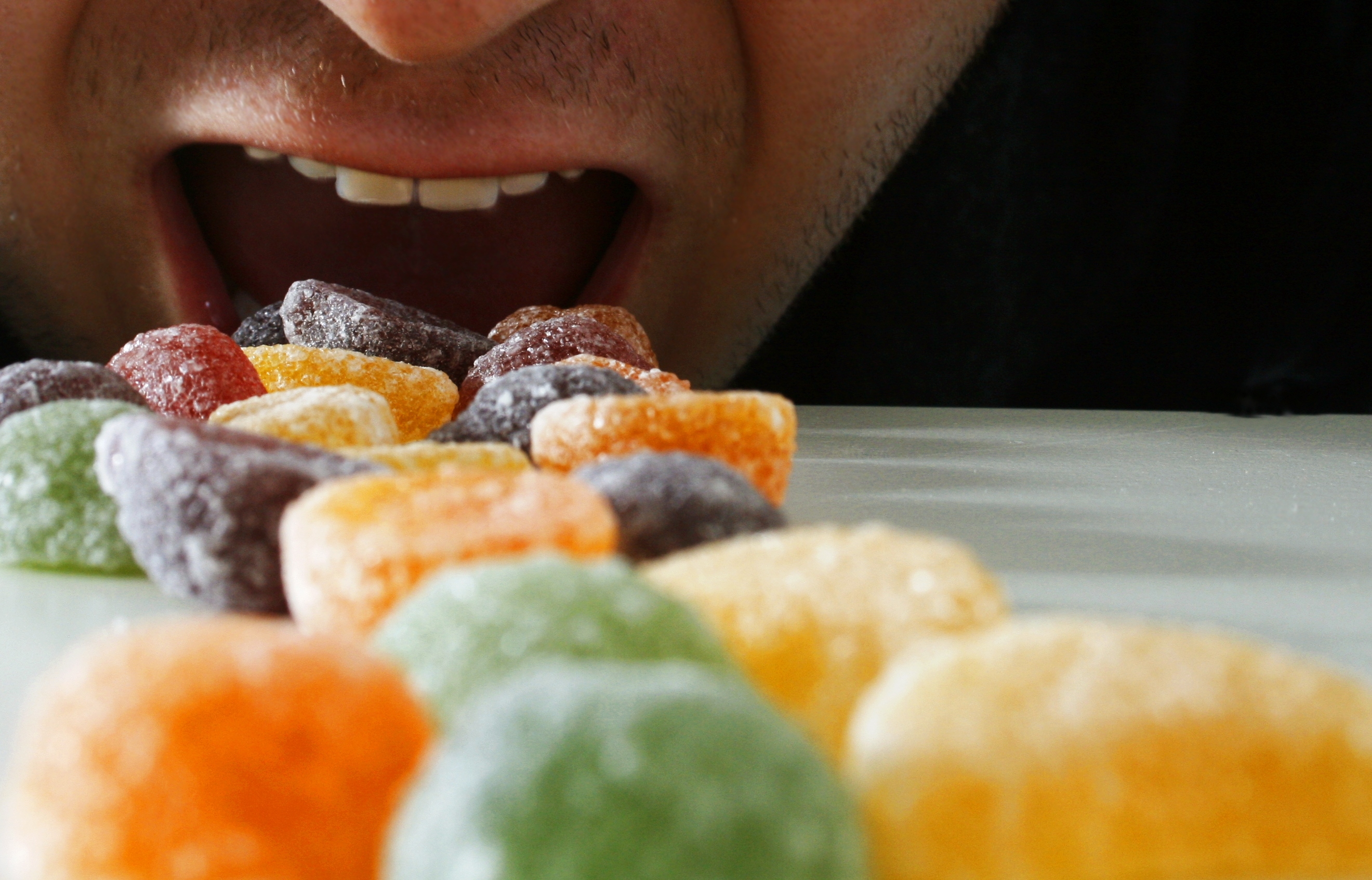 Hungry Man Eating Fruit Pastilles (Getty Images)