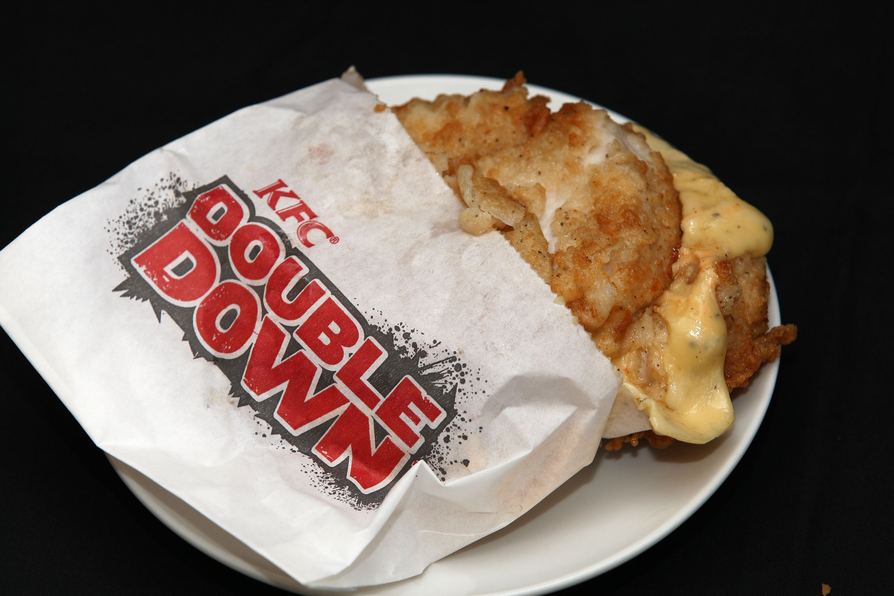 XXX YYY at XXX on May 10, 2011 in Auckland, New Zealand. The KFC 'Double Down' is a 604-calorie 'bunless' burger that consists of two strips of bacon, cheese and 'special sauce' served between two KFC chicken fillets and has been a hot topic after being condemned by nutritionists concerned with the high calorie and saturated fat content. (Sandra Mu&mdash;Getty Images)