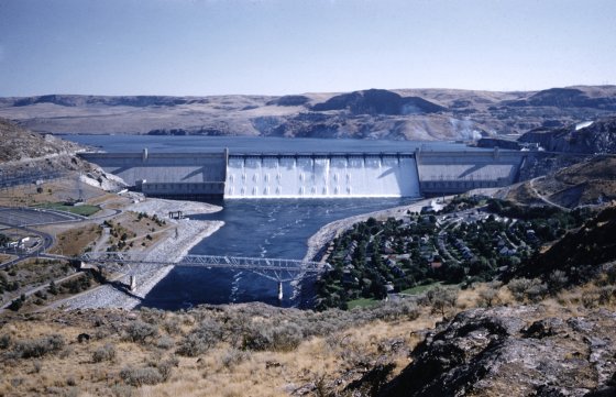 The monumental Grand Coulee Dam in Washington intercepts the Columbia River and sends its waters rushing down the 1,650-foot-wide spillway. . . .