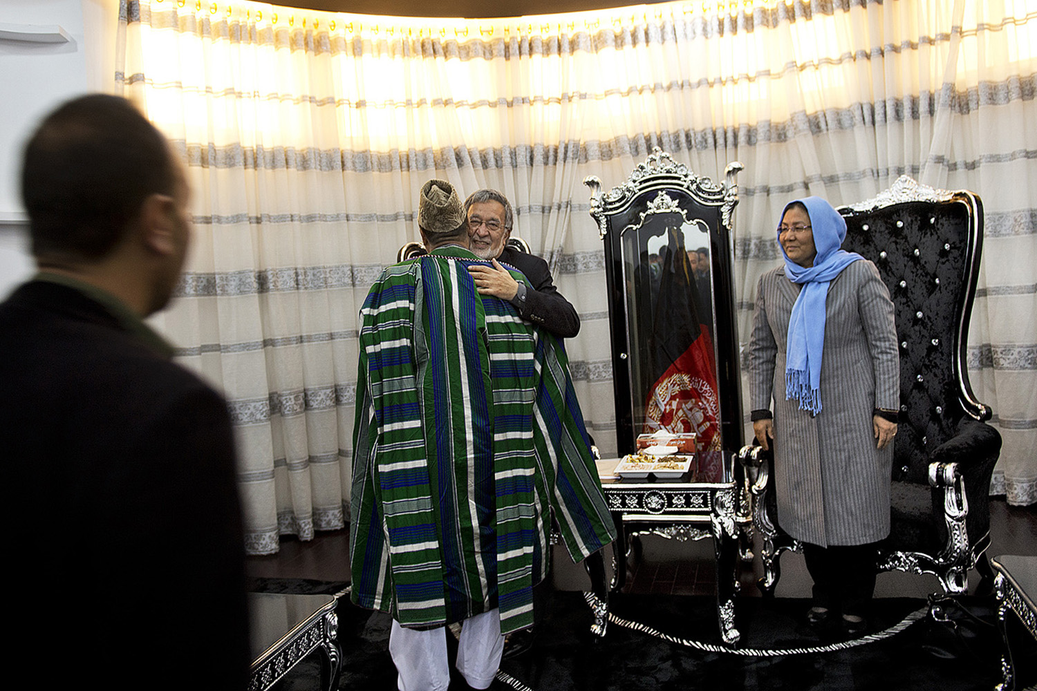 Afghan Presidential candidate Zalmai Rassoul and Vice Presidential candidate Habiba Sarabi greet visitors before attending a rally in Mazar-i-Sharif, Afghanistan, March 27, 2014.