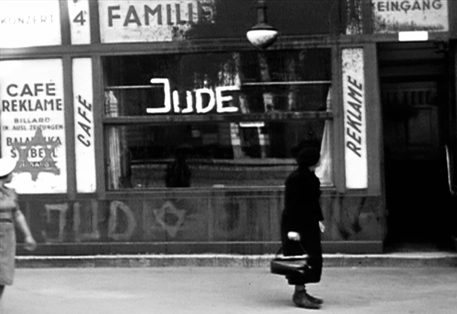 A Jewish-owned store painted with the word "Jude" (Jew) and the Star of David, Germany, late 1930s.