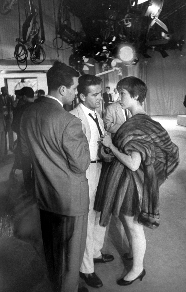 Shirley MacLaine with her husband, Steve Parker (center), and an unidentified man on the set of "Shower of Stars," 1955.
