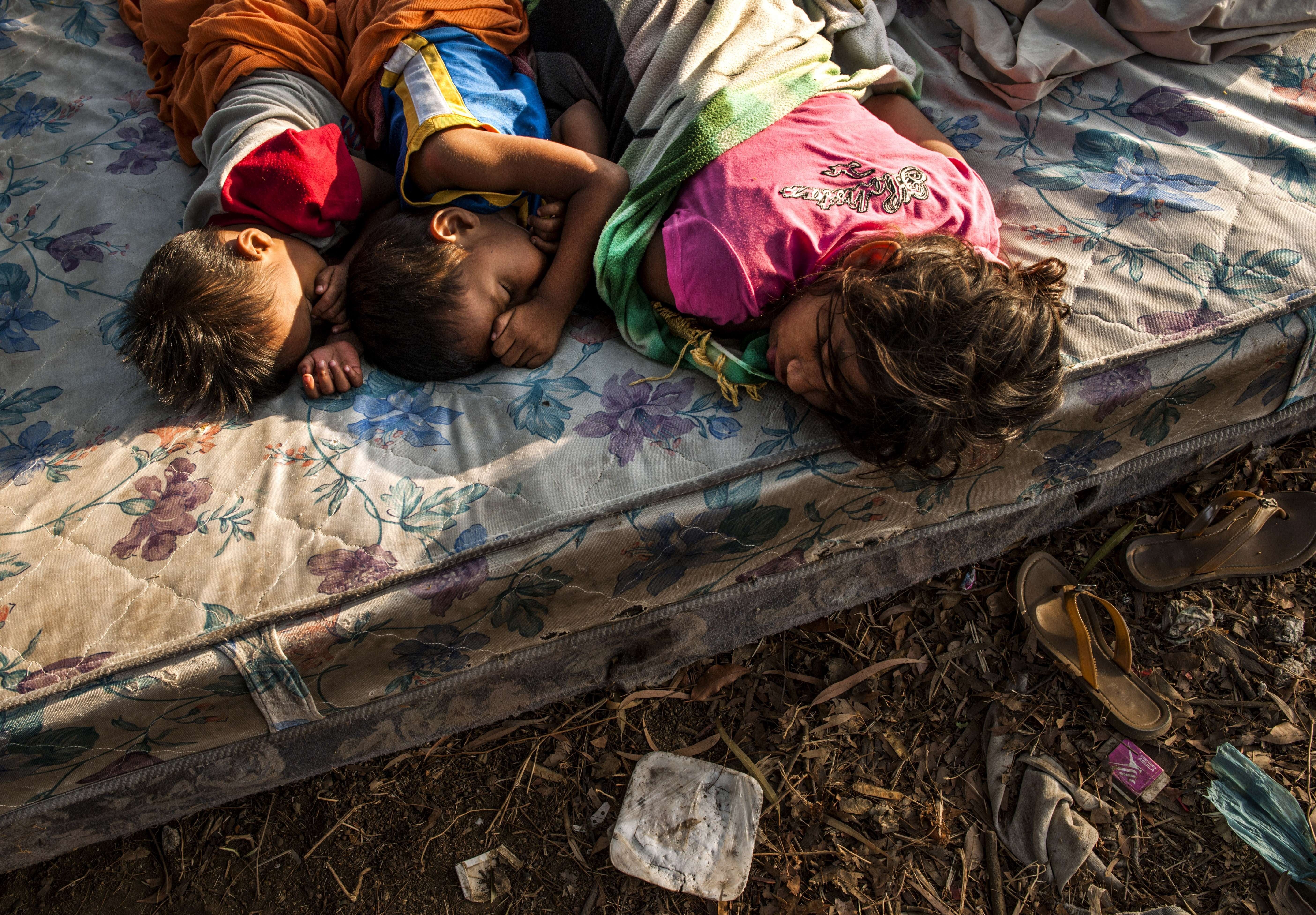 Apr. 14, 2014.
                              Children sleep on a mattress in the open sky in Managua as tremors have not stopped in Nicaragua since April 10 when a 6.2-magnitude earthquake hit the country's Pacific region.