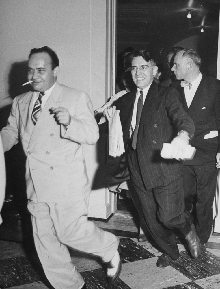 Elated reporters race to spread the news of Japan's surrender, August 1945.