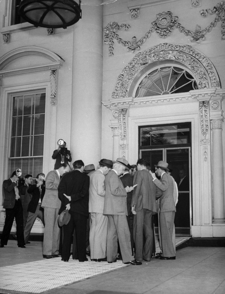 Reporters after a press conference at the White House, 1941.