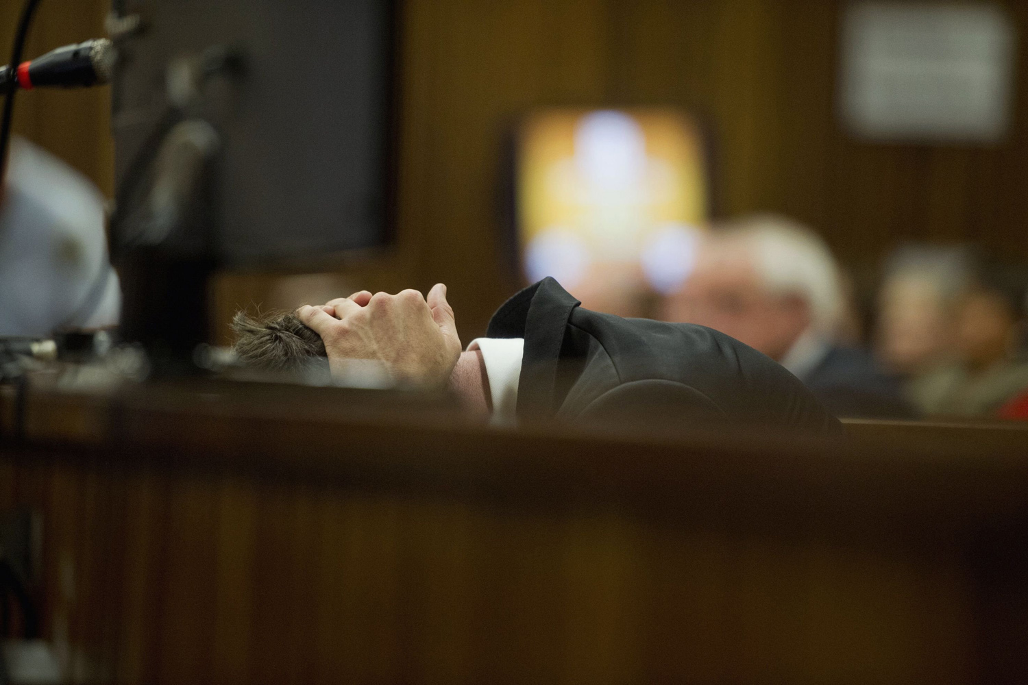 Apr. 7, 2014. Oscar Pistorius reacts during his trial at the high court in Pretoria. South African Paralympic and Olympic track star Oscar Pistorius is expected to take the stand for the first time on Monday in a bid to prove his innocence against charges he murdered his model girlfriend Reeva Steenkamp.