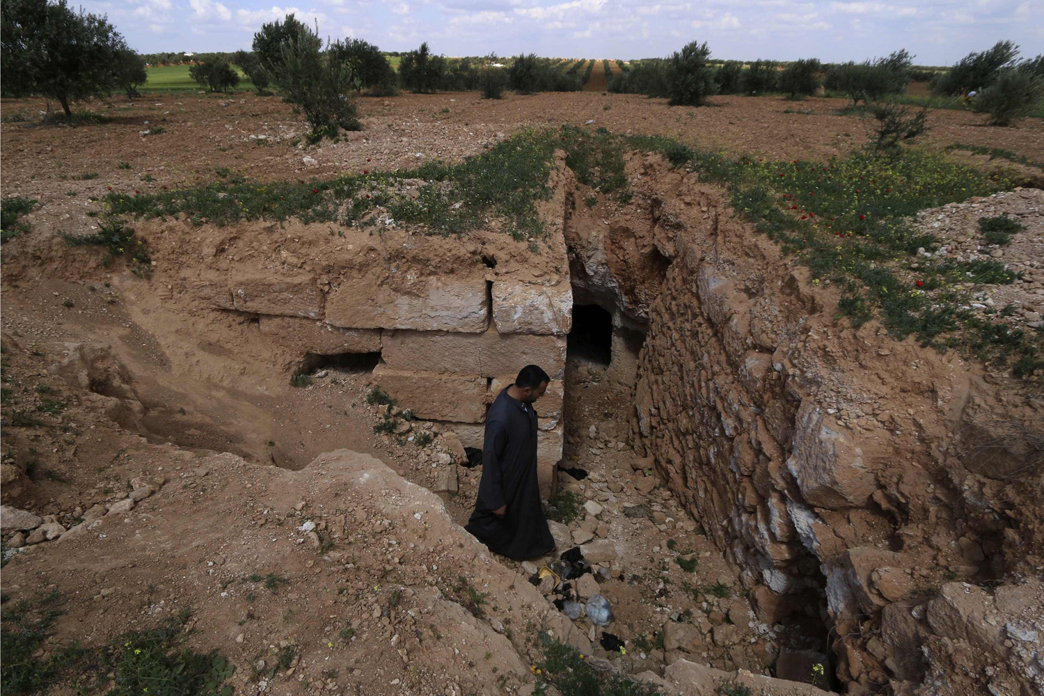 A man enters underground shelter in Idlib countryside