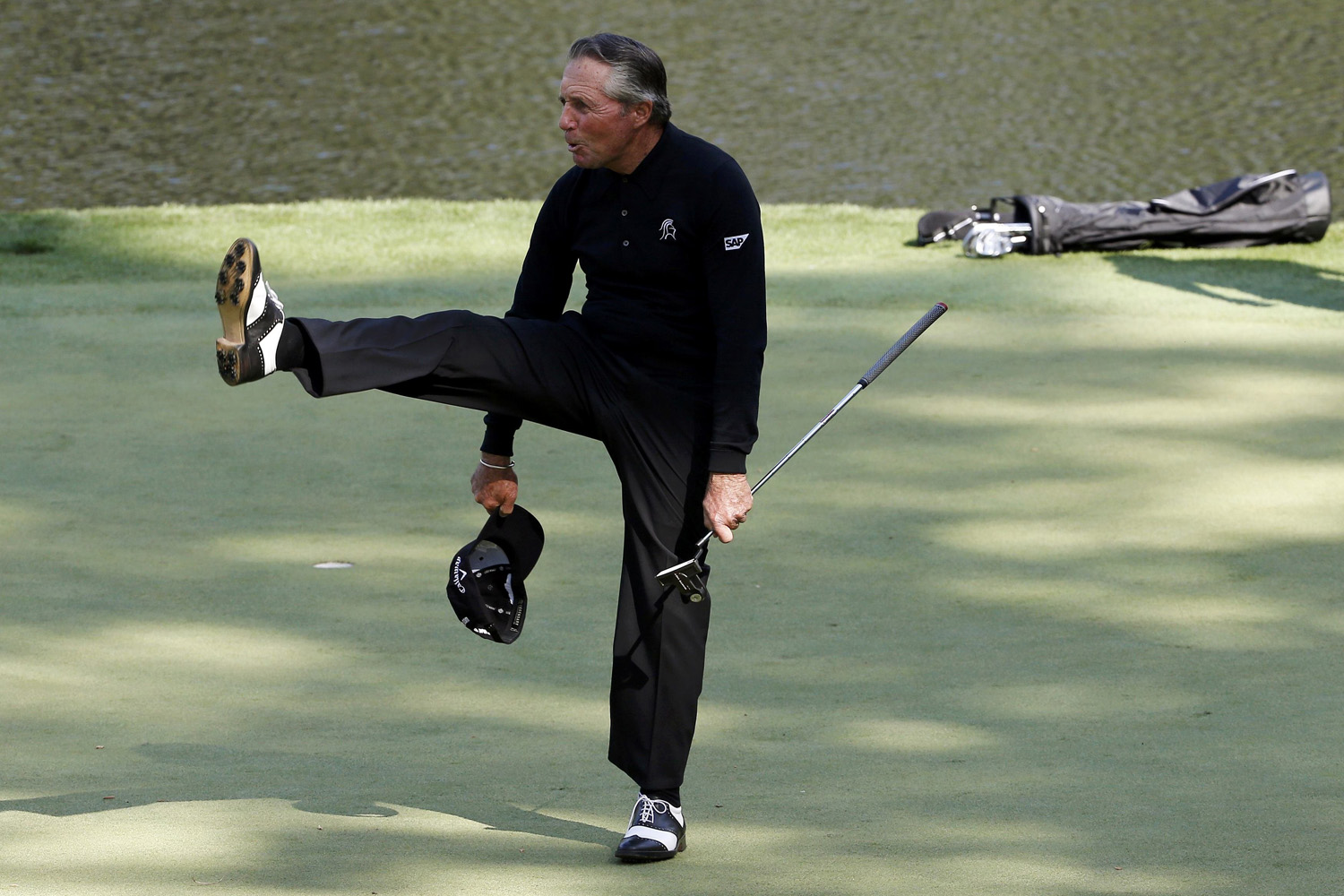 Former Masters champion Gary Player of South Africa reacts after a putt on the ninth hole during the Par 3 Contest at the Augusta National Golf Club in Augusta