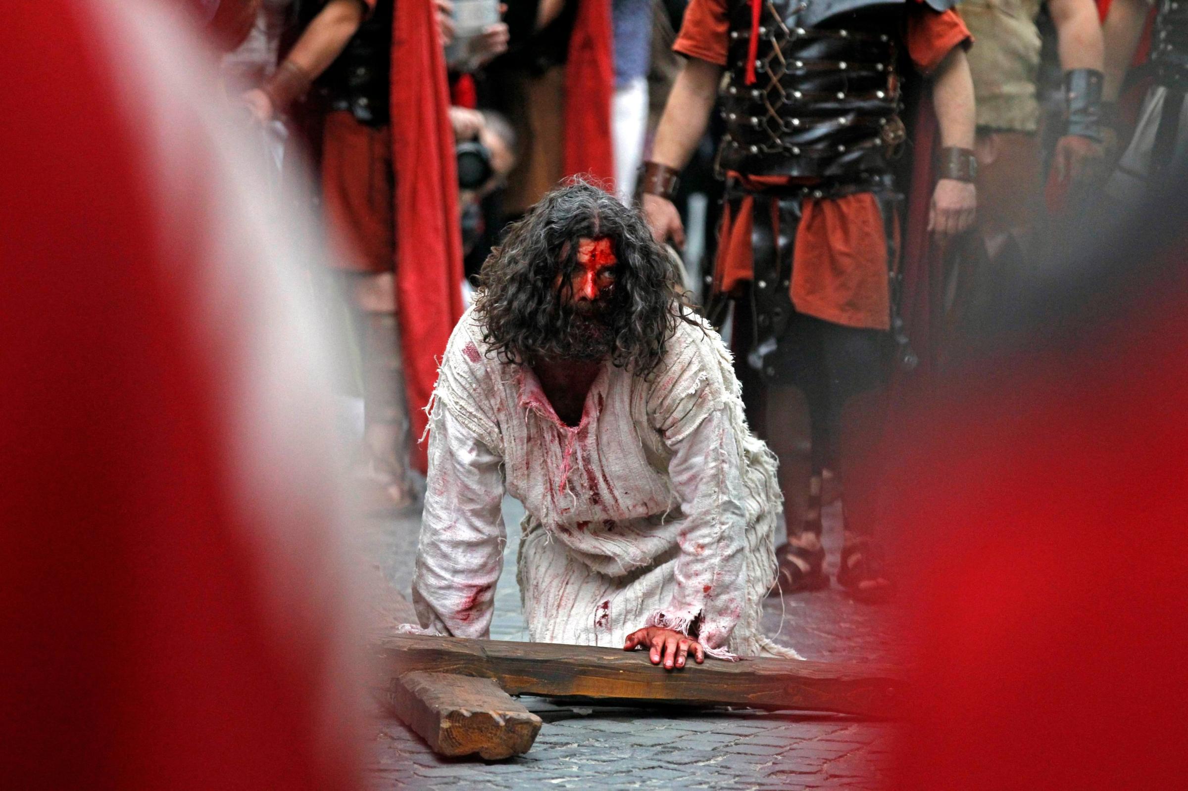 An actor takes part in a re-enactment of the "Via Crucis" during the Orthodox Holy Week celebrations in Bucharest