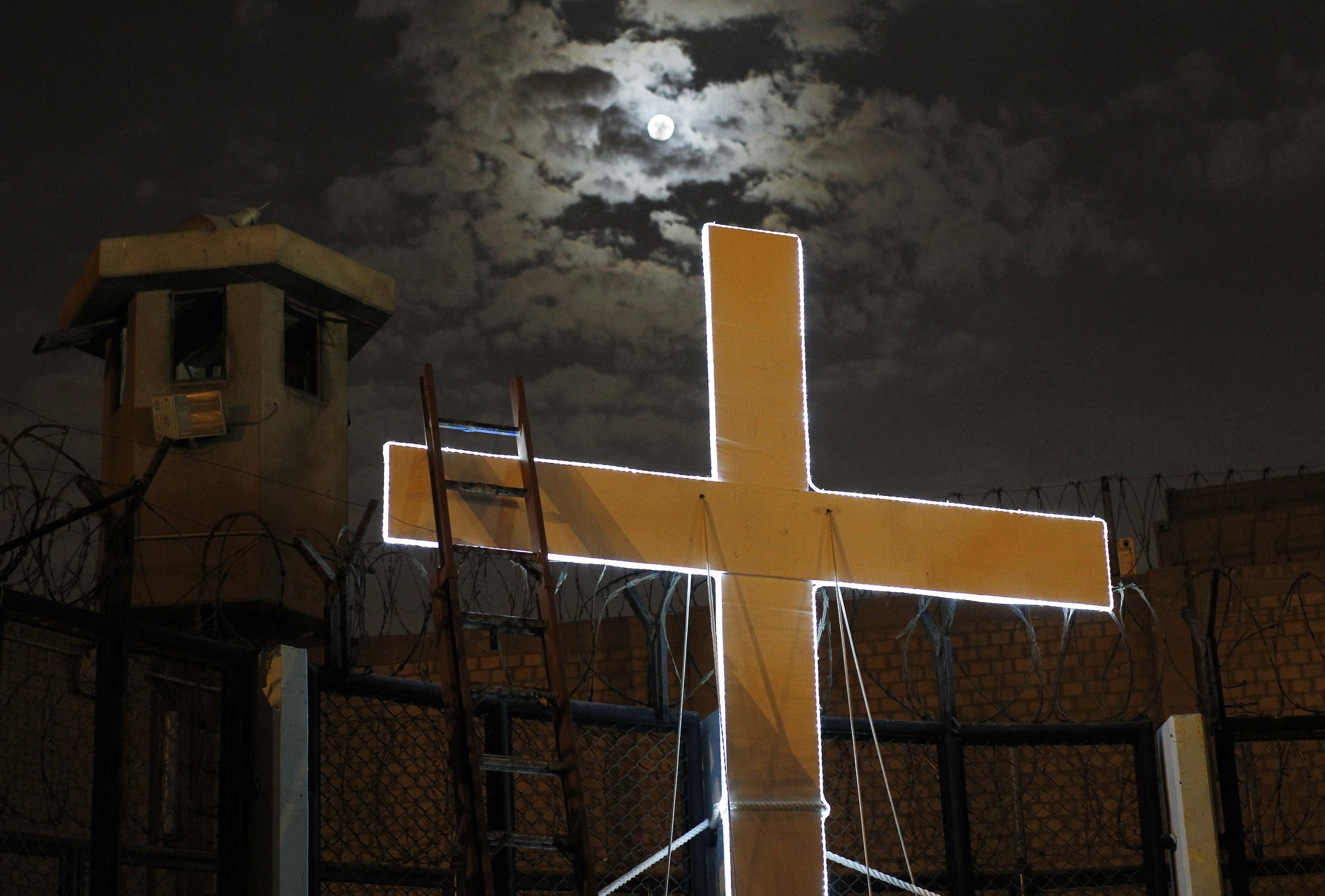 Apr. 15, 2014.  A cross is seen after the theater play  Jesus Christ Superstar  at Sarita Colonia prison yard, ahead of Holy Week celebrations, in Lima. The play was held to encourage the inmates in their rehabilitation process, according to the prison's press release.