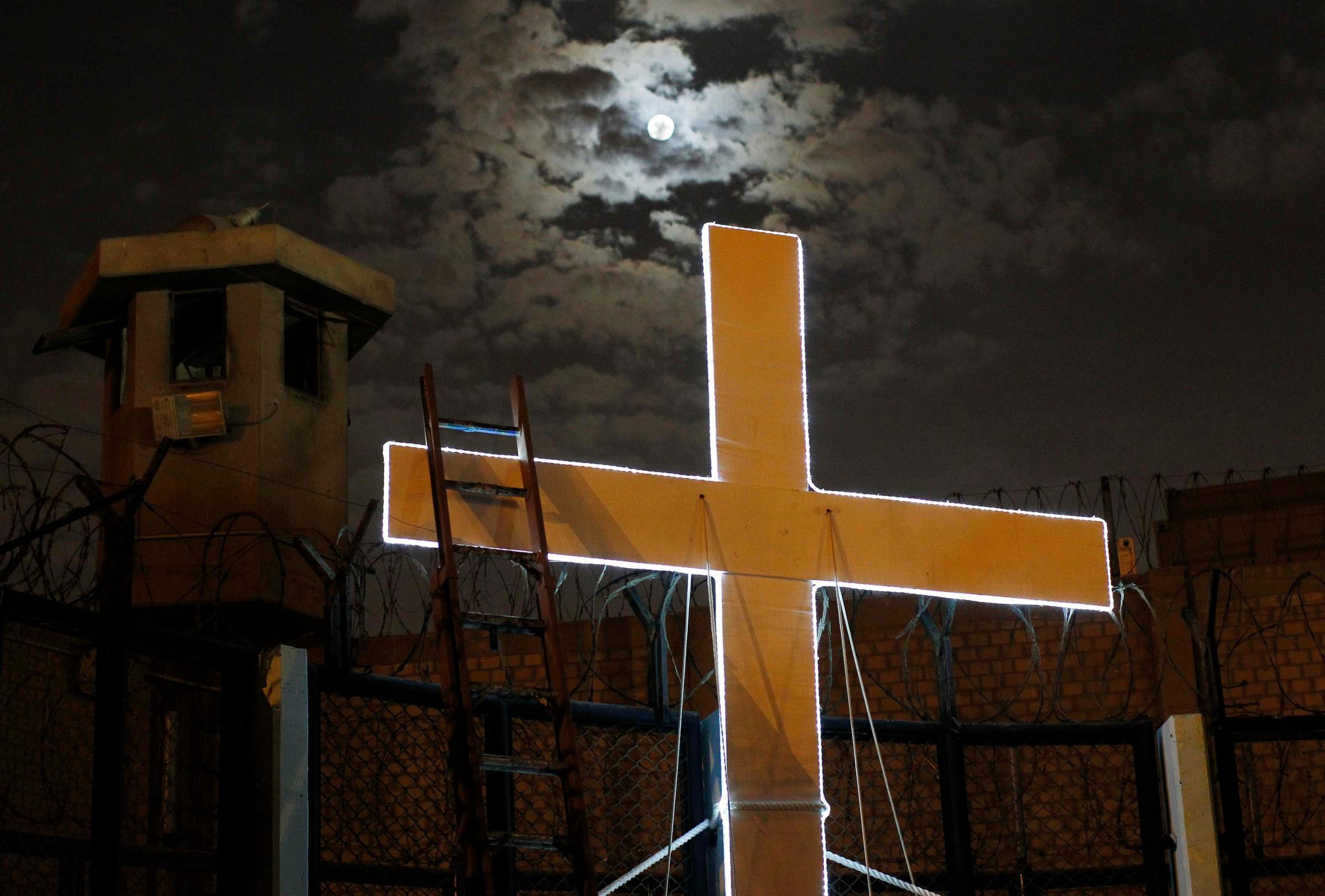A cross is seen after the theatre play "Jesus Christ Superstar" at Sarita Colonia prison yard, in Lima