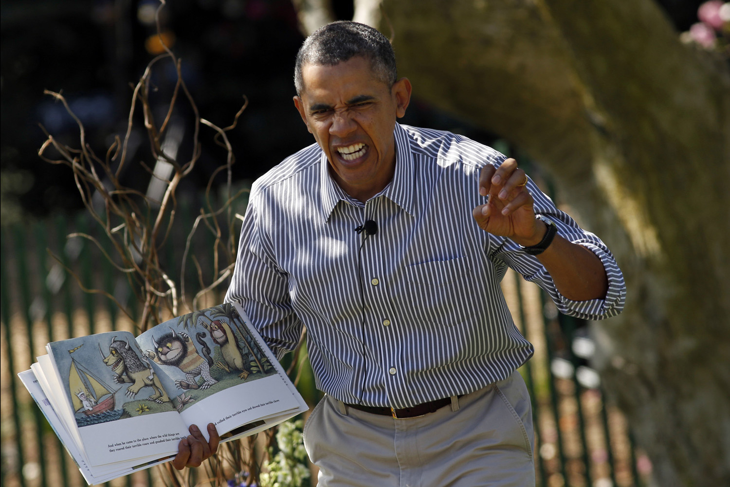 Apr. 21, 2014. U.S. President Barack Obama acts out the line  gnashed their terrible teeth  from the children's book  Where the Wild Things Are  during the 136th annual Easter Egg Roll on the South Lawn of the White House in Washington.