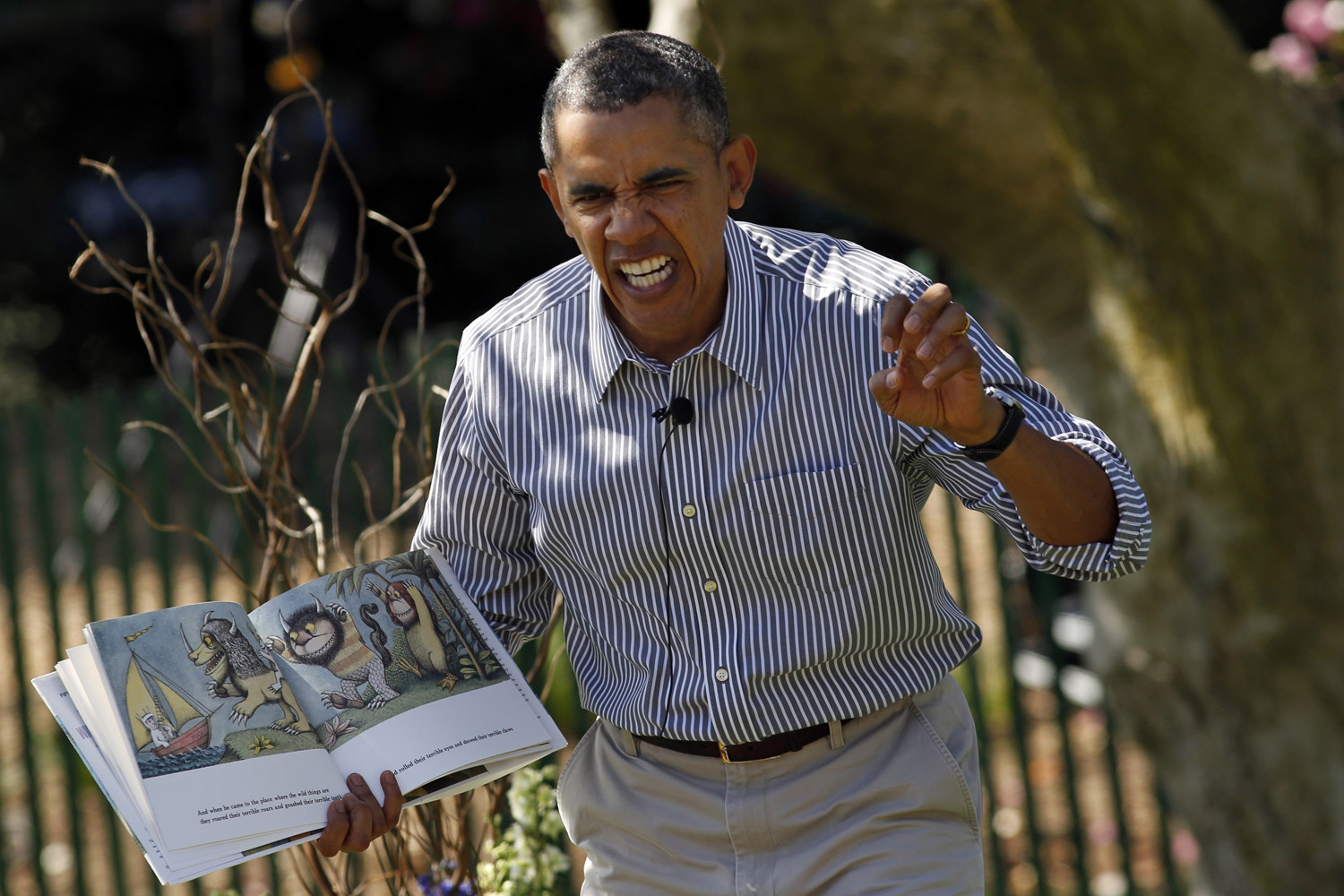 U.S. President Barack Obama acts out the line  gnashed their terrible teeth  from the children's book  Where the Wild Things Are  during the 136th annual Easter Egg Roll on the South Lawn of the White House in Washington April 21, 2014.