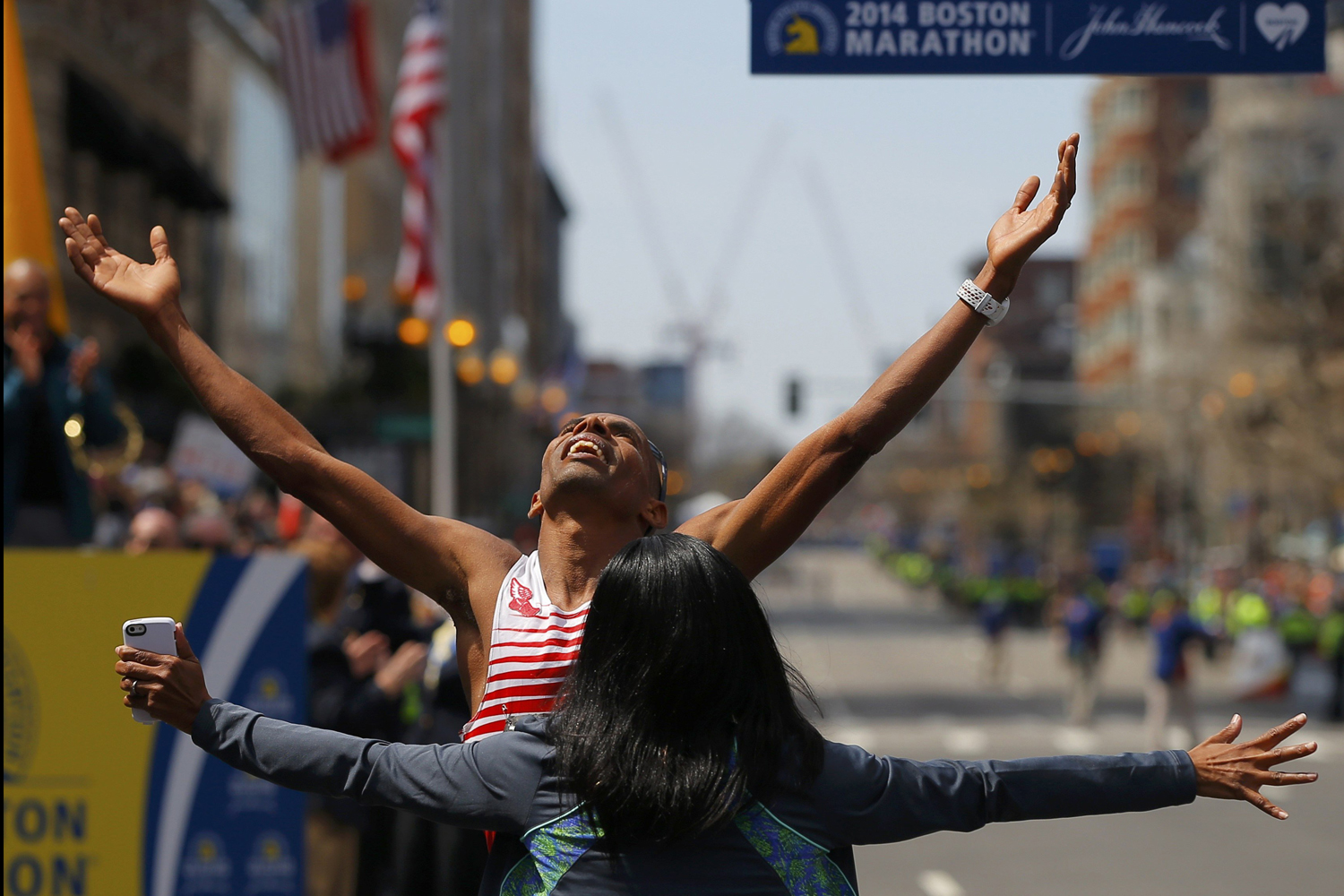 Meb Keflezighi of the U.S. celebrates with his wife Yordanos Asgedom after winning the men's division at the 118th running of the Boston Marathon