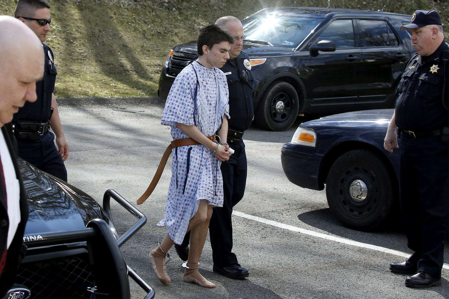 Apr. 9, 2014, Alex Hribal, the suspect in the multiple stabbings at the Franklin Regional High School in Murrysville, Pa., is escorted by police to a district magistrate to be arraigned on Wednesday in Export, Pa.