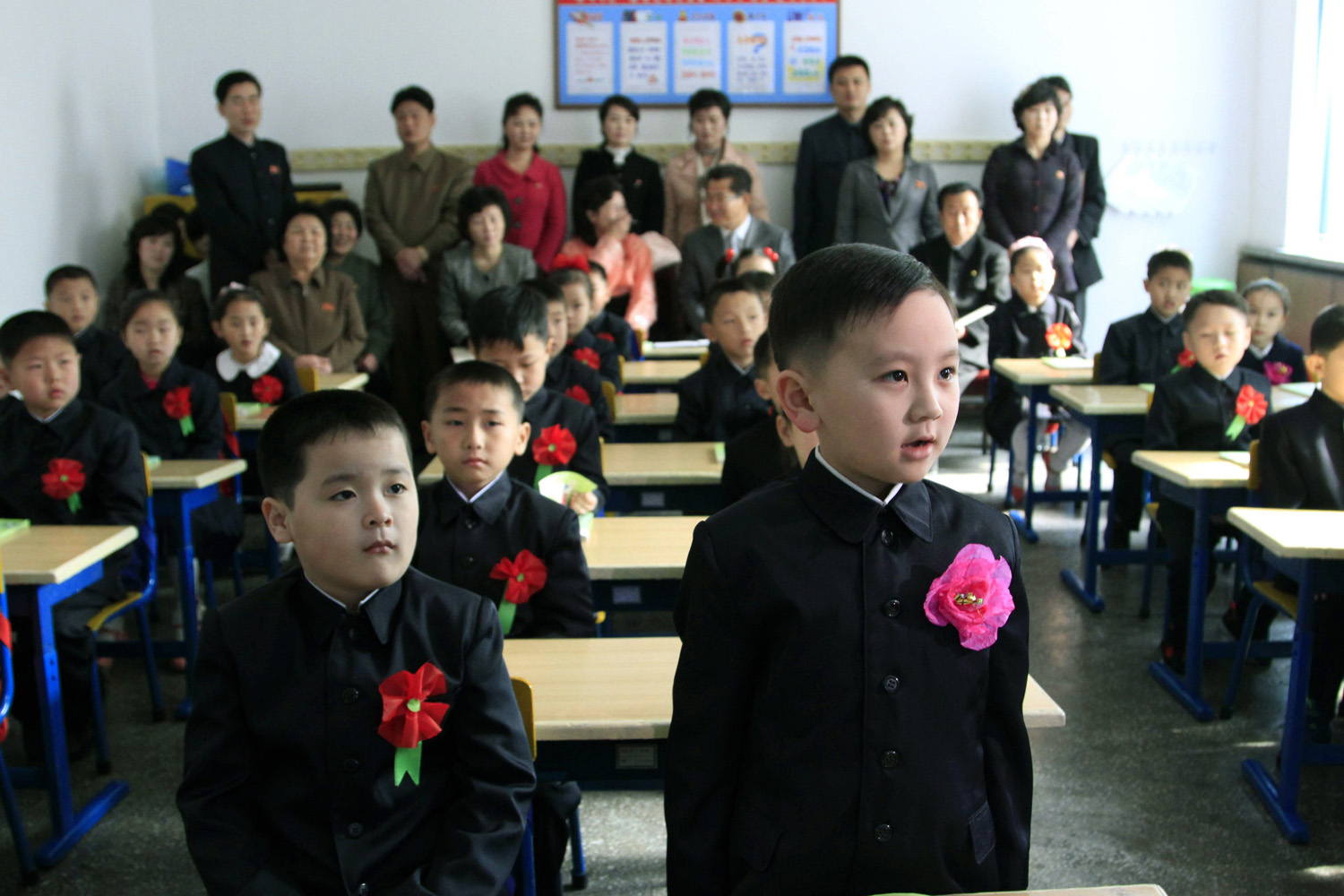 Apr. 1, 2014. A student stands while answering his teacher's question as he and his new classmates participate in their first lesson at the Pyongyang Primary School No.4 while their parents watch in Pyongyang, North Korea.