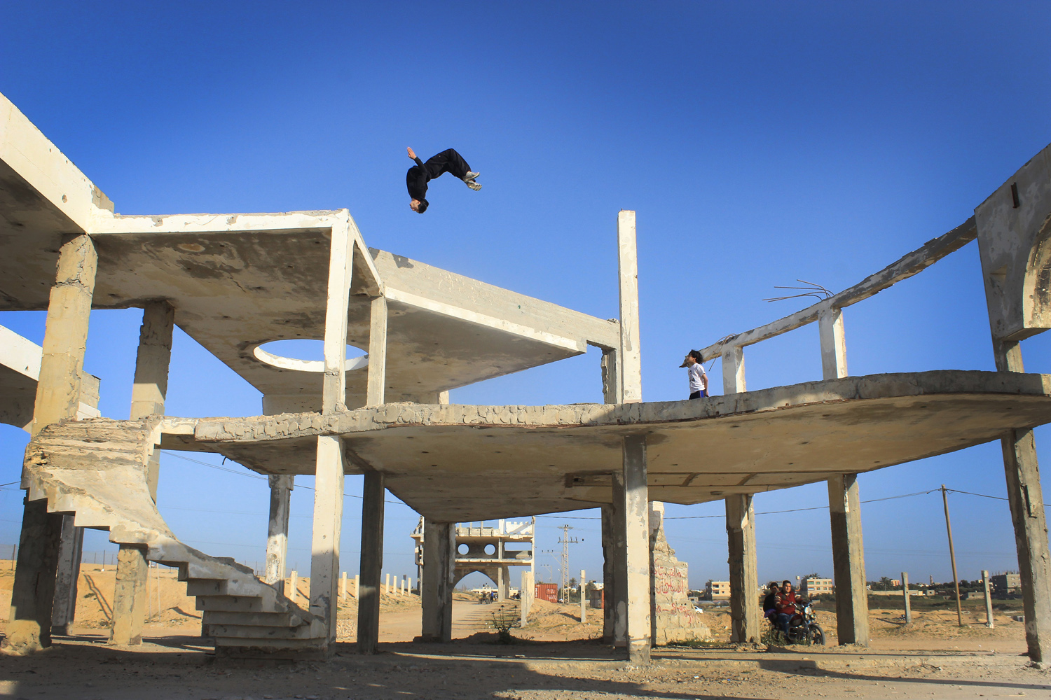 A Parkour team practices in Al-Waha April 4, 2014, near the Al-Sodania area that has been bombed in the last war in Gaza.