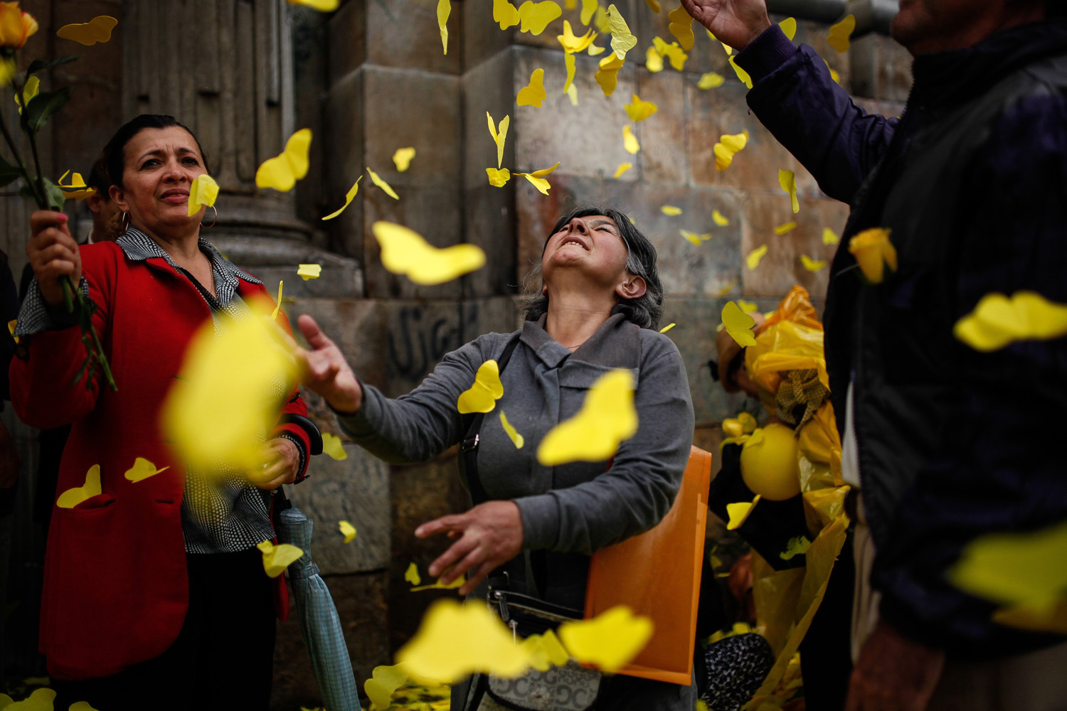 Apr. 22, 2014. Residents play with paper cut-outs of butterflies in front of the Primary Cathedral during the homage of the late Latin American writer Gabriel Garcia Marquez in Bogota, Colombia.