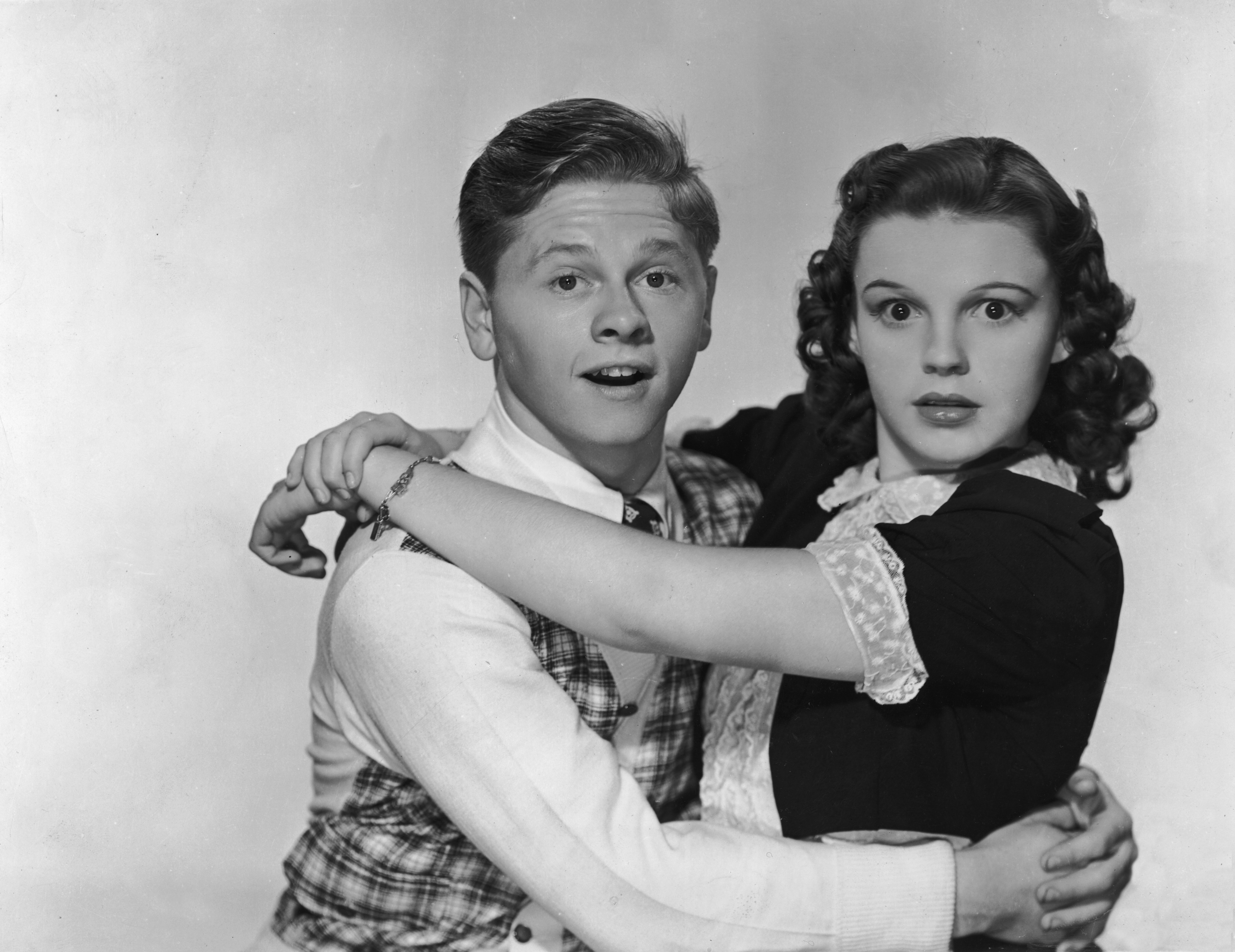 Rooney and Judy Garland pose for a promotional portrait for the film Love Finds Andy Hardy in 1938.