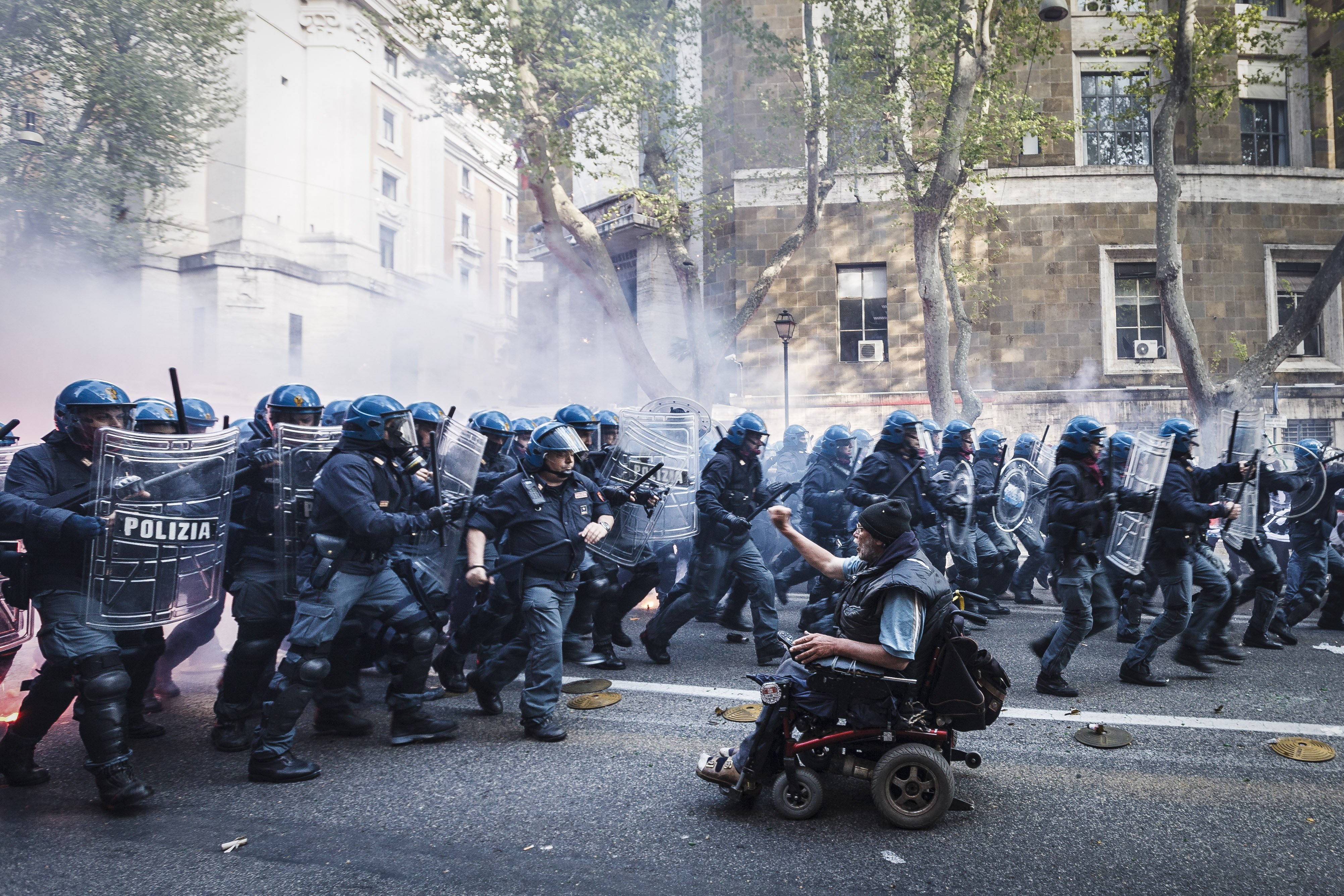 Apr. 12, 2014. Demonstrators clash with police during an anti-austerity demonstration in Rome. Thousands of protesters, from all over the country, marched against Troika austerity measures and to express their anger at governments plans to reform job market to deal with the economic crisis and its housing rights policies.