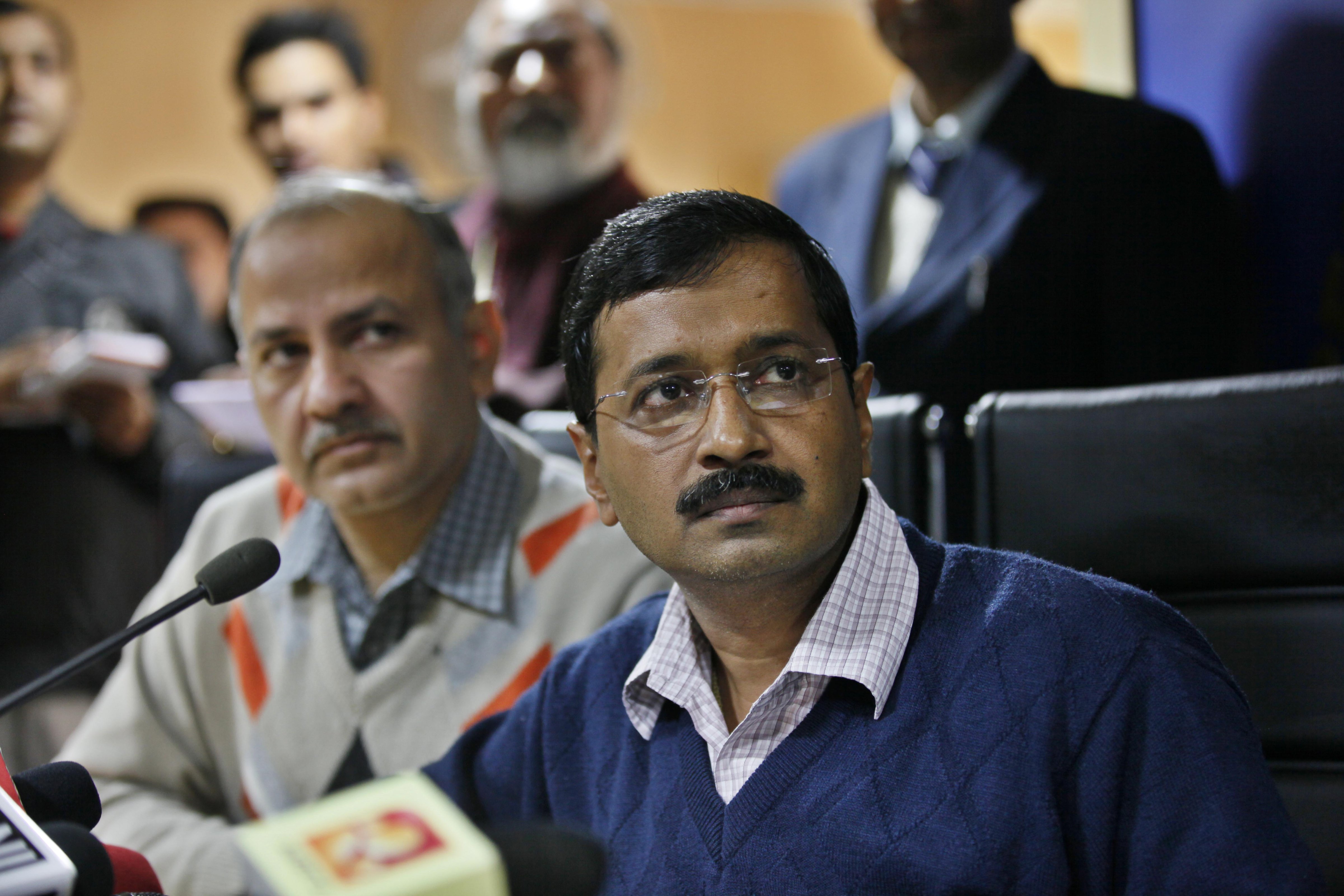 From right: Delhi Chief Minister Arvind Kejriwal and Manish Sisodia address a news conference on Feb. 11, 2014 in New Delhi. (Raj K. Raj—Hindustan Times/Getty Images)