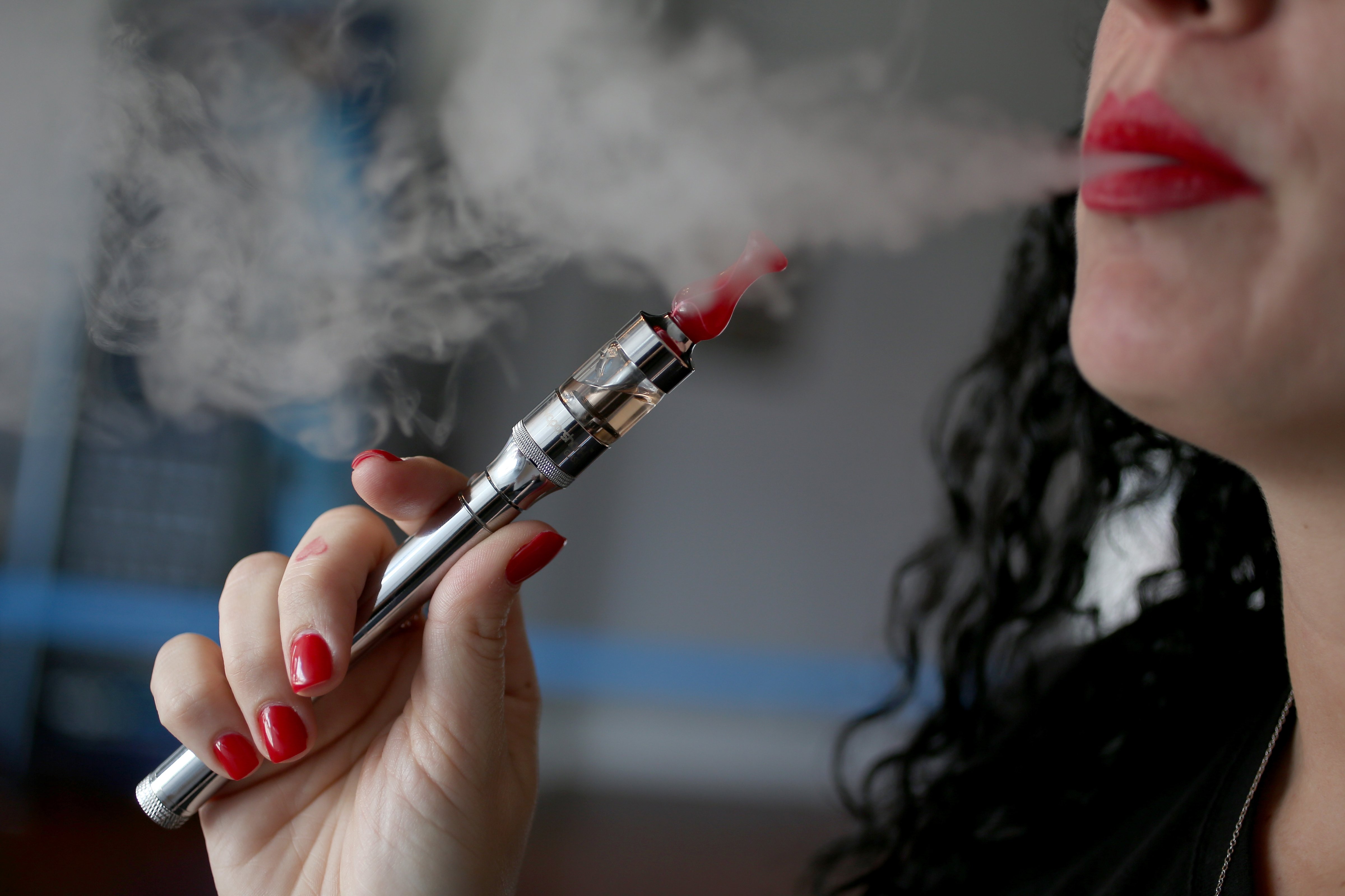 A patron enjoys an electronic cigarette at the Vapor Shark store in Miami on Feb. 20, 2014 (Joe Raedle—Getty Images)
