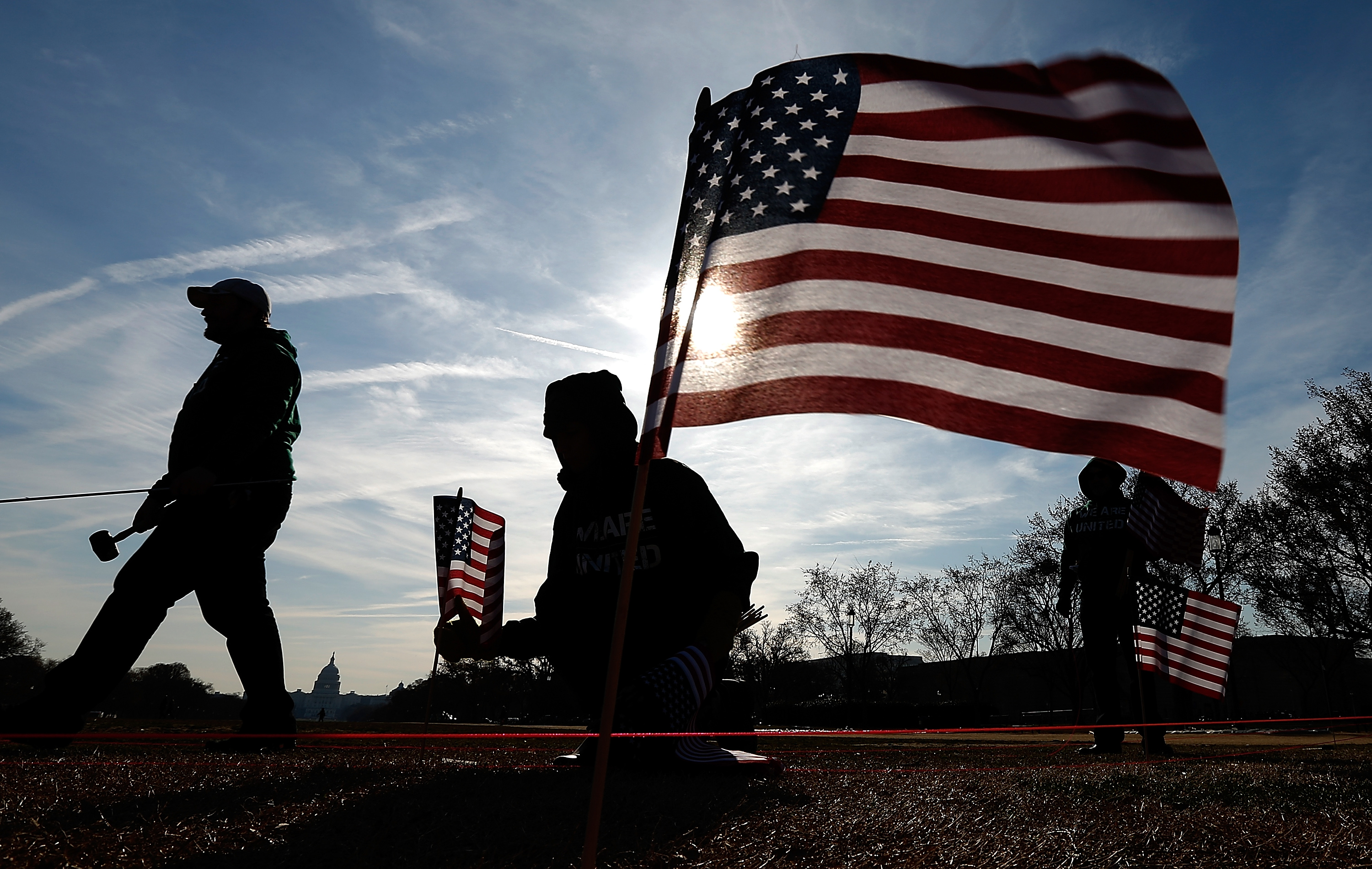 U.S. military veterans set up 1,892 American flags on the National Mall March 27, 2014 in Washington, DC. The Iraq and Afghanistan Veterans of America installed the flags to represent the 1,892 veterans and service members who committed suicide this year. (Win McNamee&amp;mdash;Getty Images)
