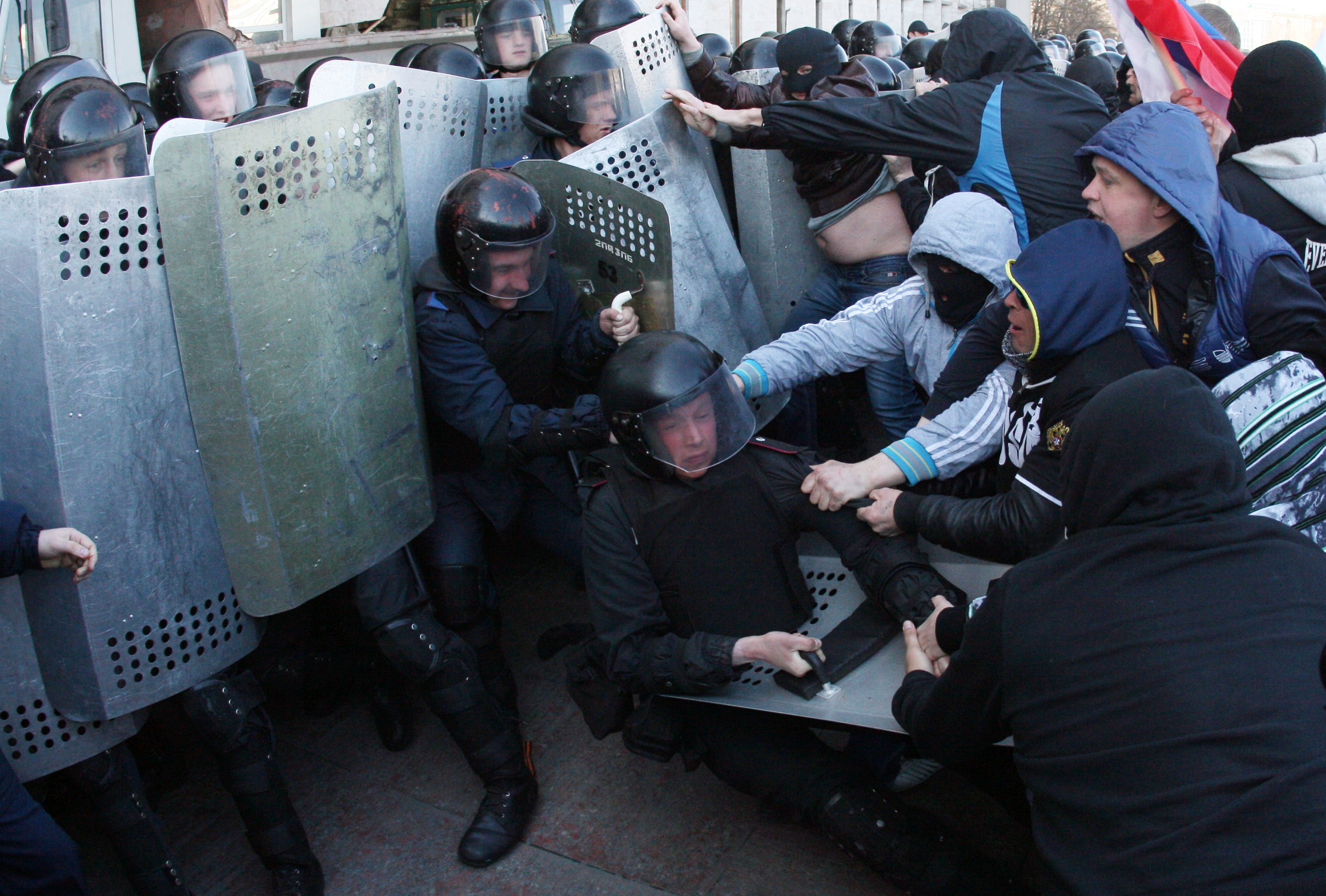 Pro-Russian supporters clash with members of the riot police as they storm the regional administration building in Donetsk, Ukraine, on April 6, 2014 (Alexander Khudoteply—AFP/Getty Images)