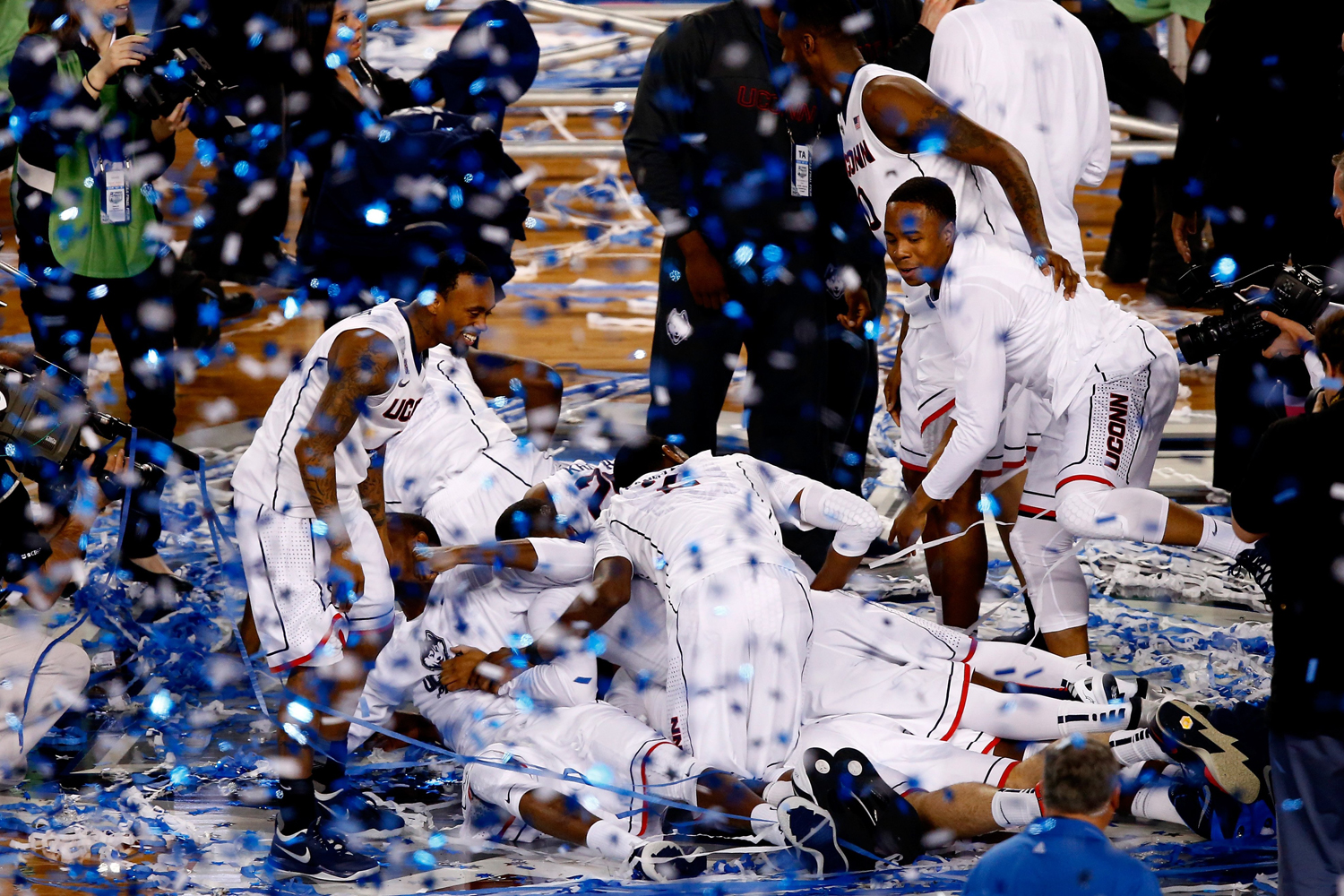The Connecticut Huskies celebrate after defeating the Kentucky Wildcats 60-54 in the NCAA Men's Final Four Championship at the AT&T Stadium on April 7, 2014 in Arlington, Texas.