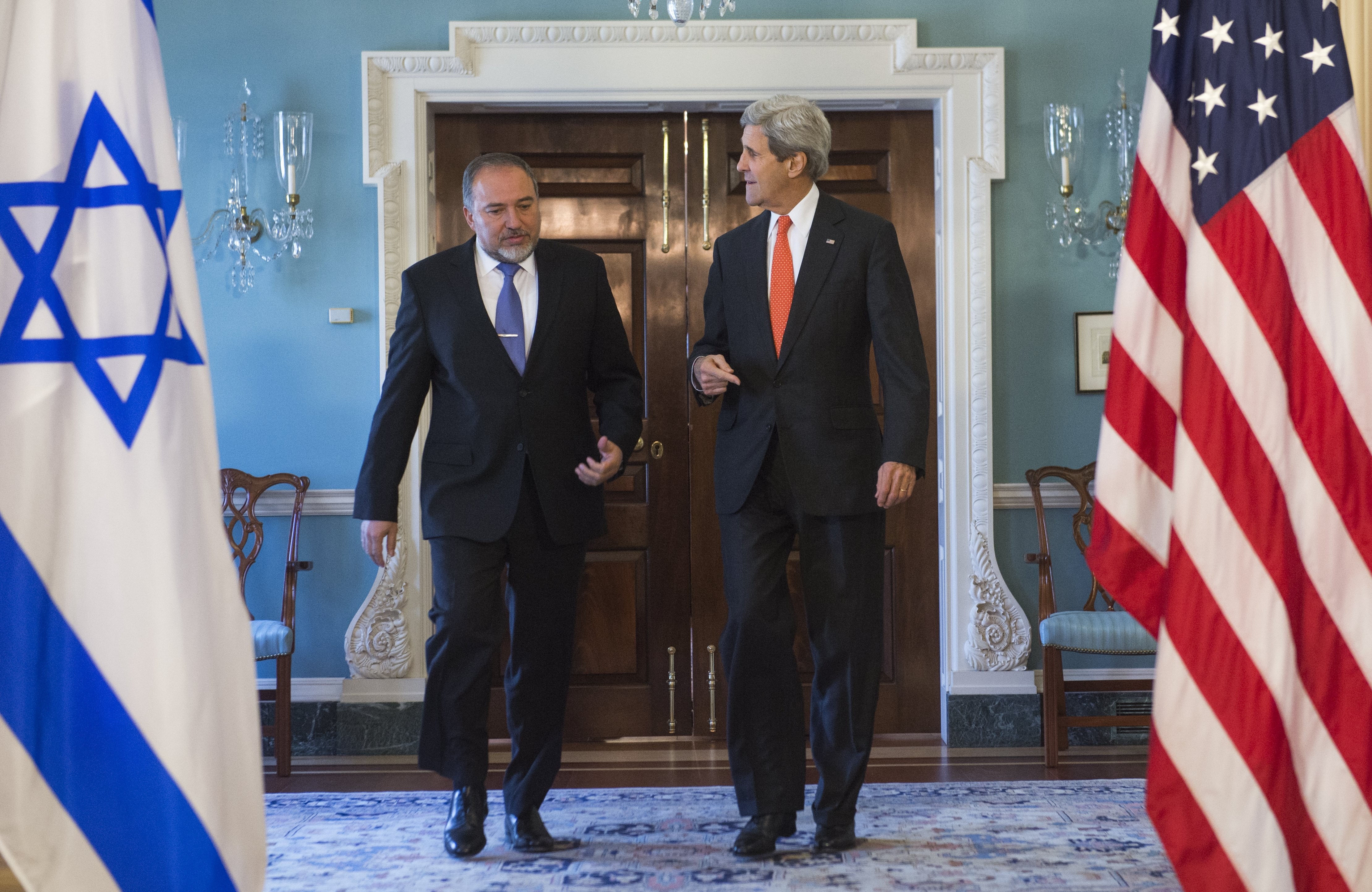 U.S. Secretary of State John Kerry and Israeli Foreign Minister Avigdor Lieberman (L) arrive to speak to the media prior to meetings at the State Department in Washington, DC, April 9, 2014. (SAUL LOEB—AFP/Getty Images)