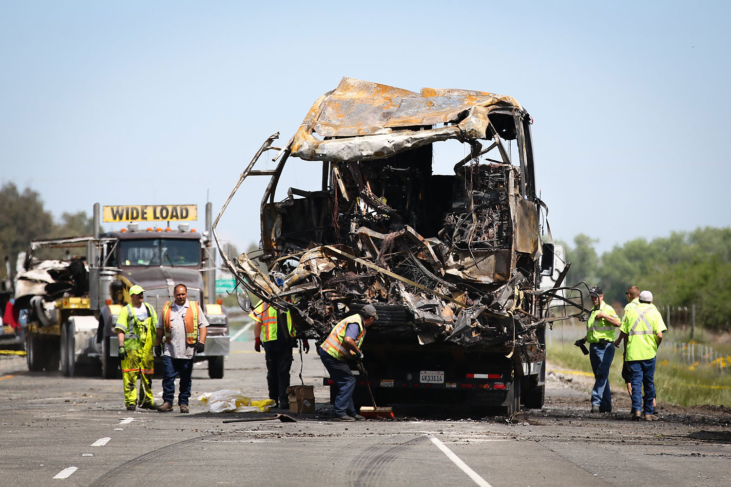 A bus involved in the deadly crash is loaded on to a truck at the scene on April 11, 2014  in Orland, California. (Elijah Nouvelage—Getty Images)