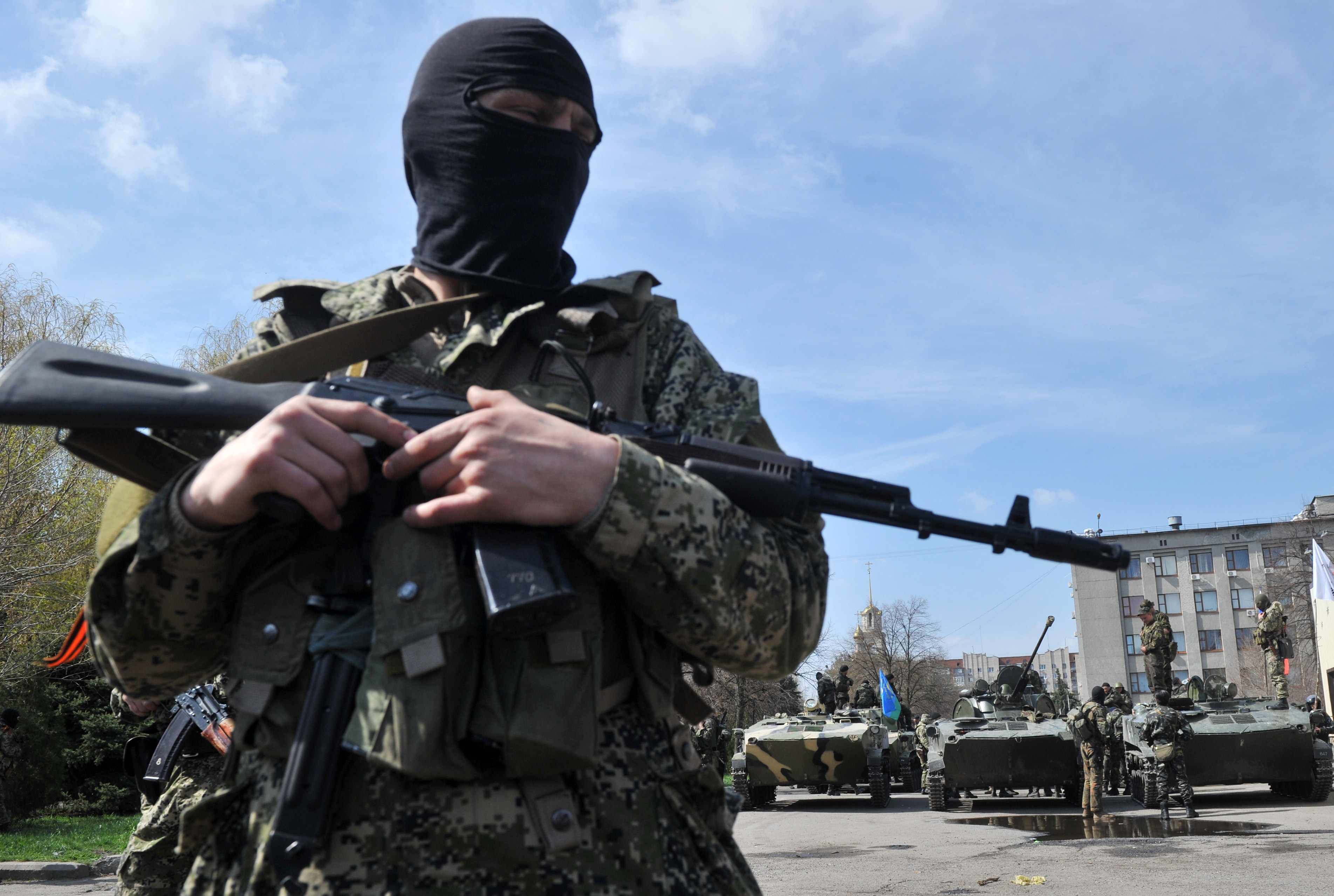 Armed militants outside the regional state building seized by pro-Russian separatists in the eastern Ukrainian city of Slavyansk on Wednesday. (Genya Savilov / AFP / Getty Images)