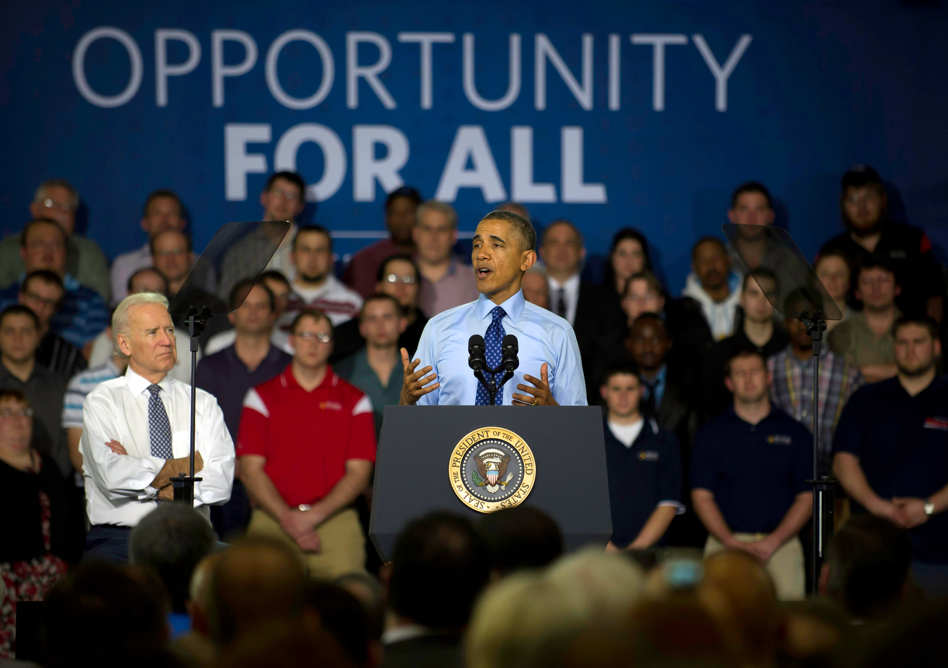 President Barack Obama and Vice President Joe Biden speak to guests at the Community College of Allegheny County on April 16, 2014 in Oakdale, Pa. (Jeff Swensen—Getty Images)