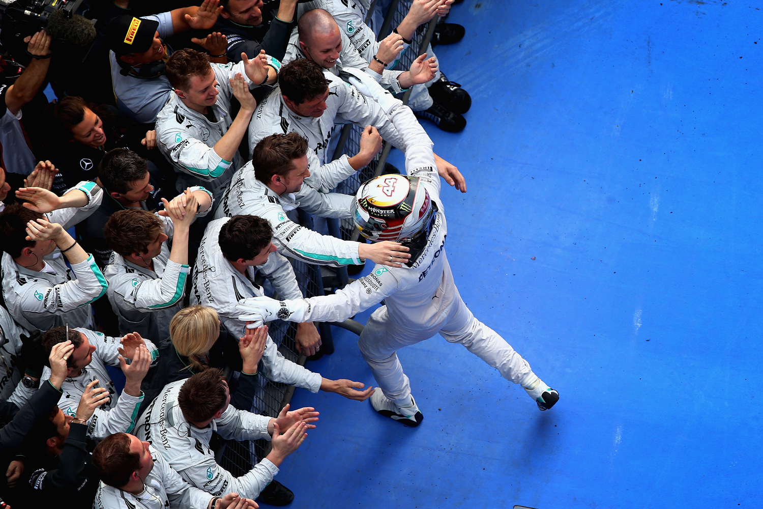 Lewis Hamilton of Great Britain and Mercedes GP celebrates his victory with his team following the Chinese Formula One Grand Prix at the Shanghai International Circuit on April 20, 2014 in Shanghai, China.