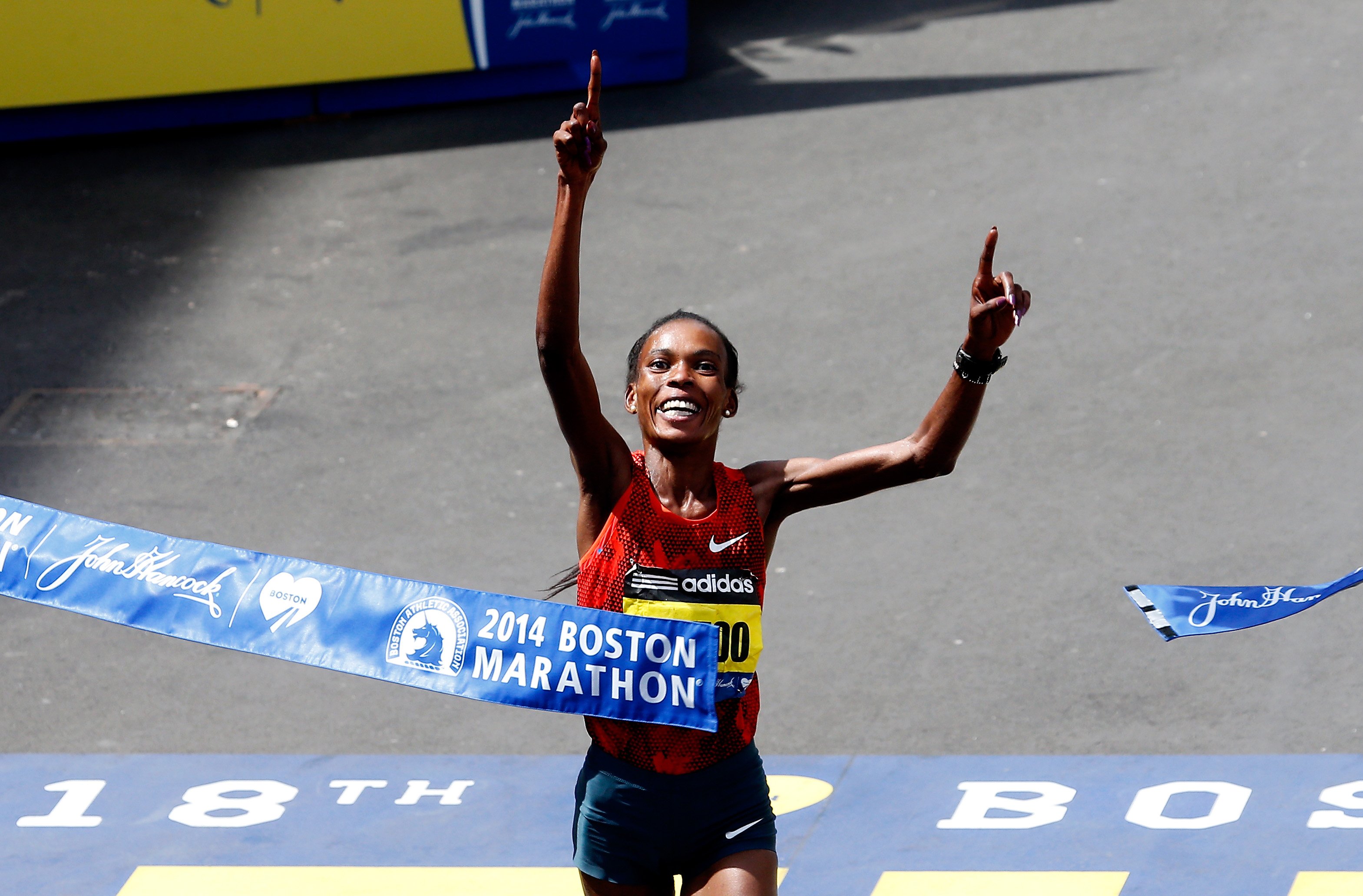 Rita Jeptoo of Kenya crosses the finish line to win the 118th Boston Marathon on April 21, 2014 in Boston, Ma. (Jim Rogash—Getty Images)