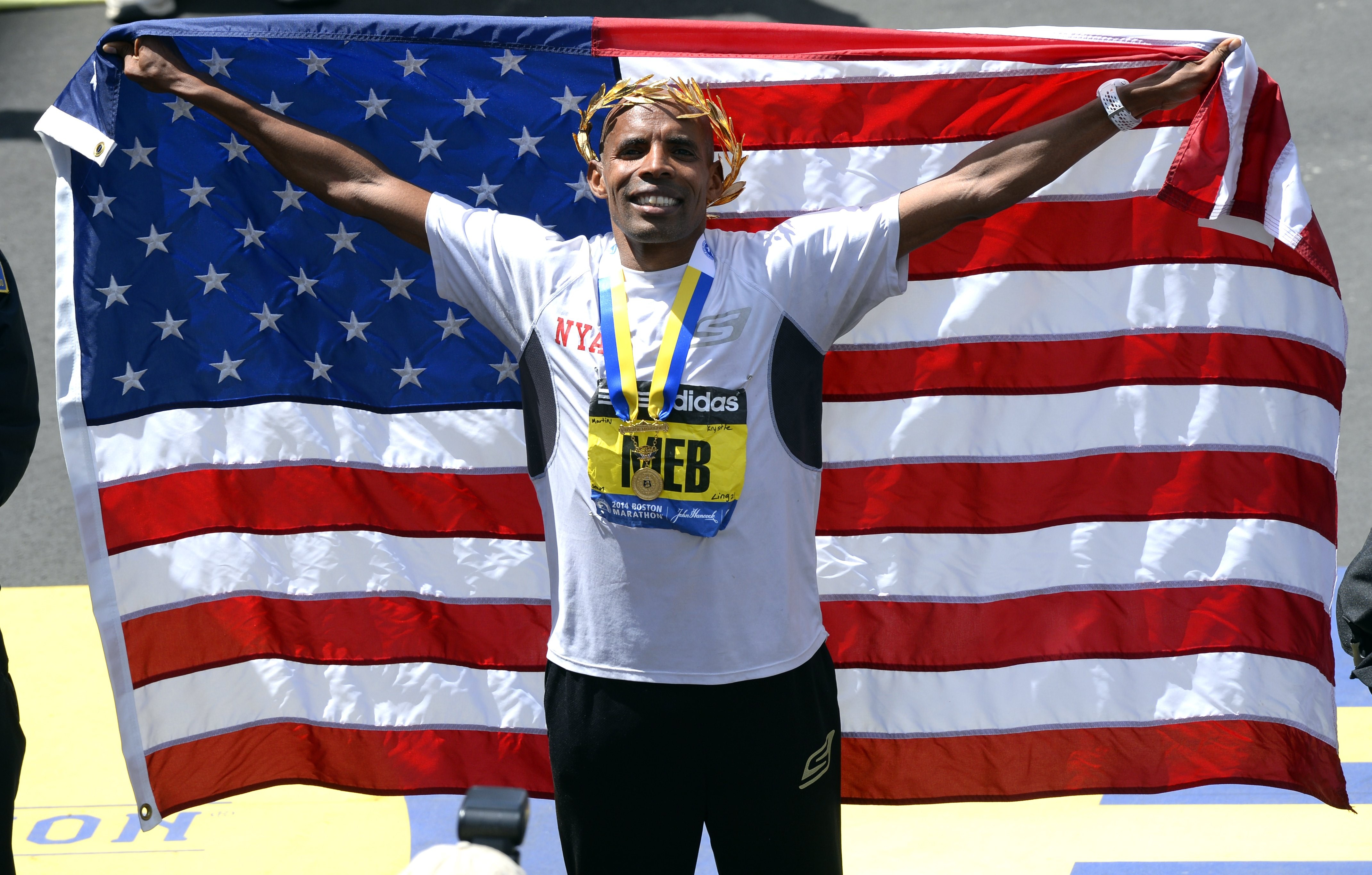 Meb Keflezighi of the US, celebrates after winning the Men's Elite division of the 118th Boston Marathon in Boston, Massachusetts April 21, 2014 . (TIMOTHY A. CLARY—AFP/Getty Images)