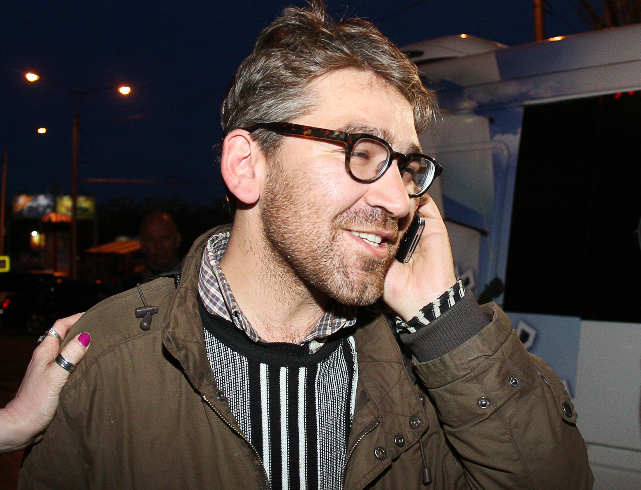 Simon Ostrovsky, who was abducted and held by pro-Kremlin rebels in east Ukraine this week, speaks on a mobile phone as he arrives in a hotel in the eastern Ukrainian city of Donetsk after being freed, on April 24, 2014. (Alexander Khudoteply—AFP/Getty Images)
