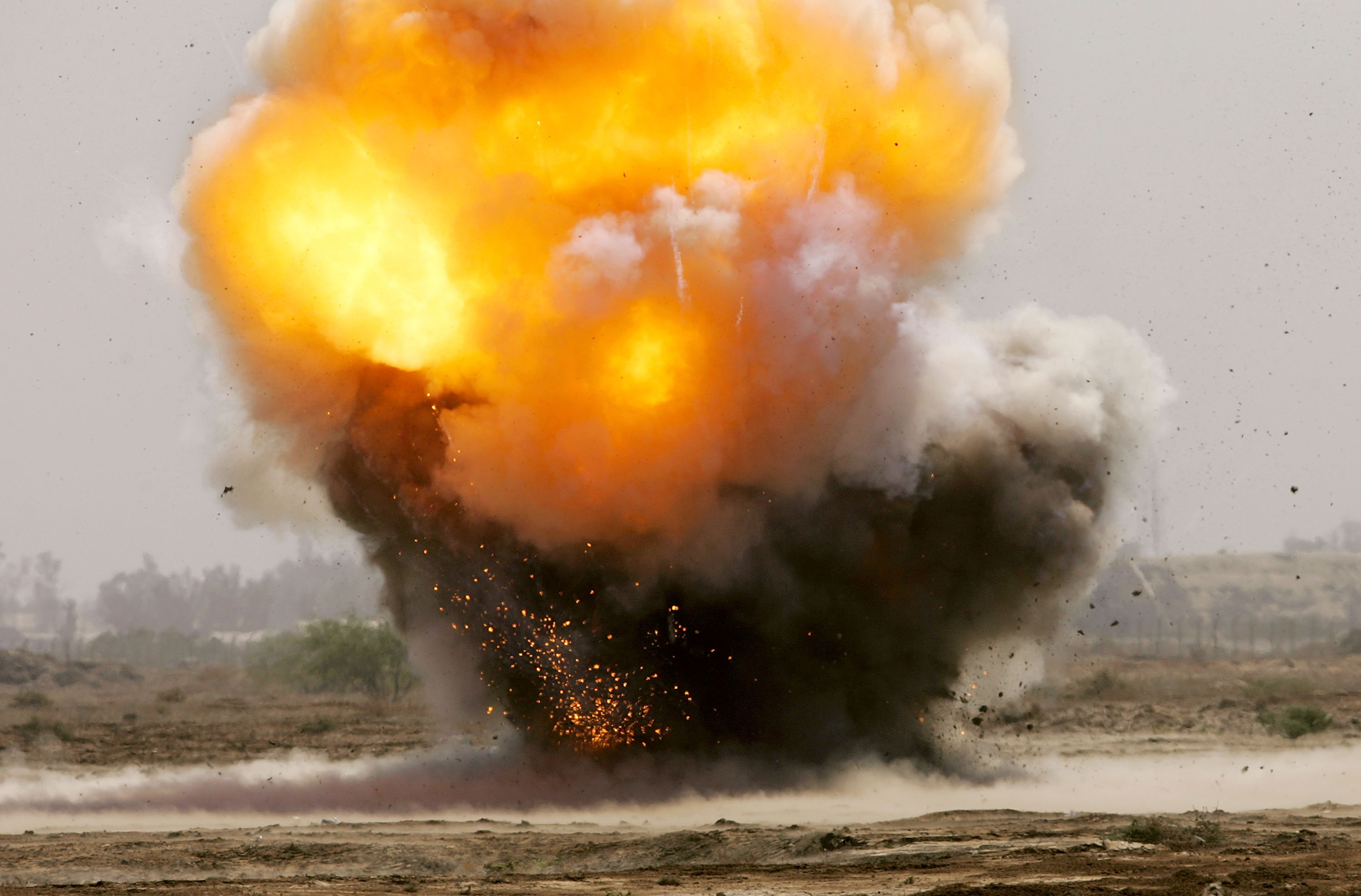 Captured explosives used in roadside bombs are detonated by an Army bomb-disposal unit in Baghdad in 2005. (John Moore / Getty Images)