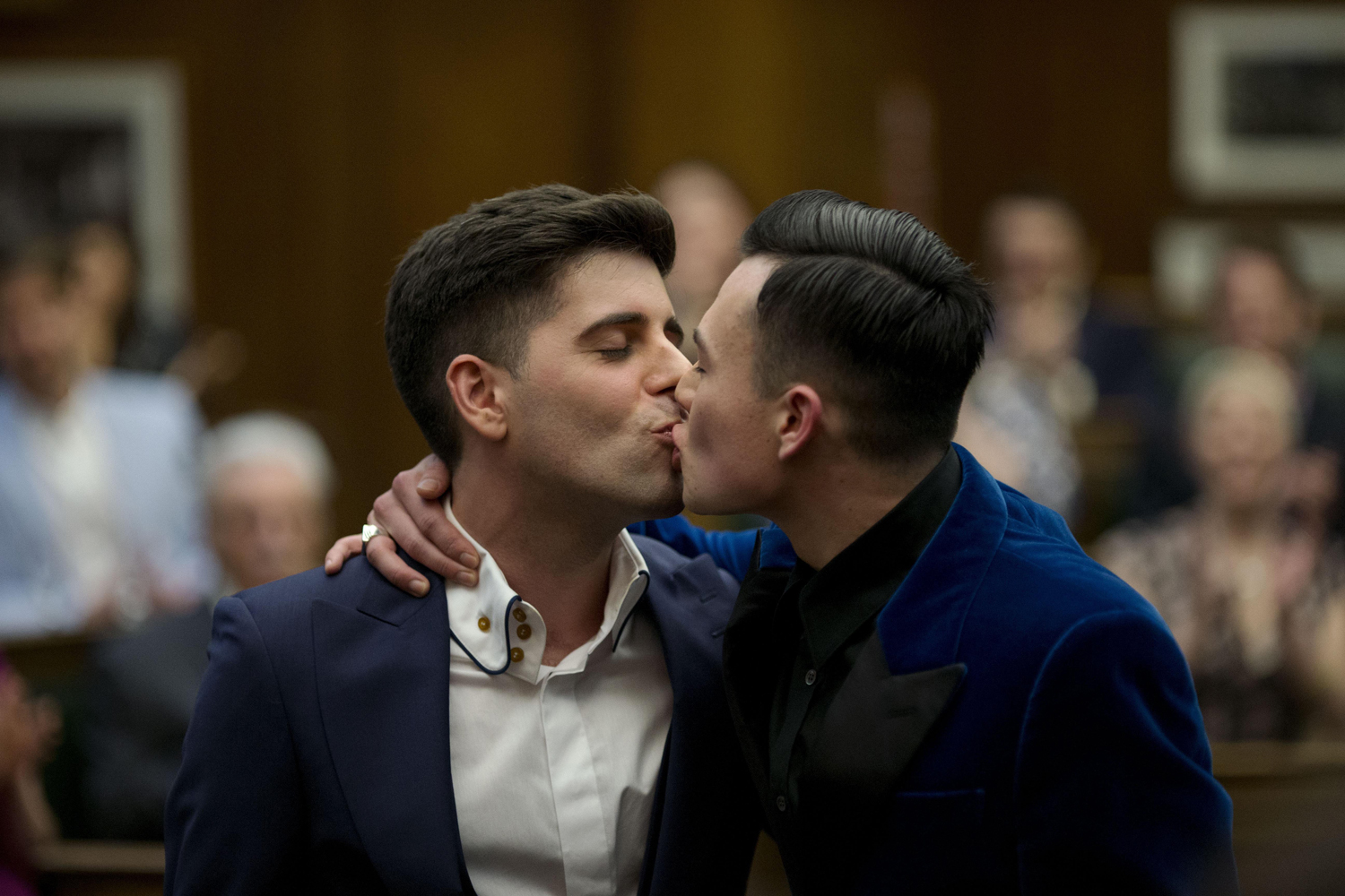 From left, Sean Adl-Tabatabai and Sinclair Treadway kiss each other after they were announced officially married during a wedding ceremony in London, minutes into March 29, 2014. Gay couples in Britain waited decades for the right to get married.