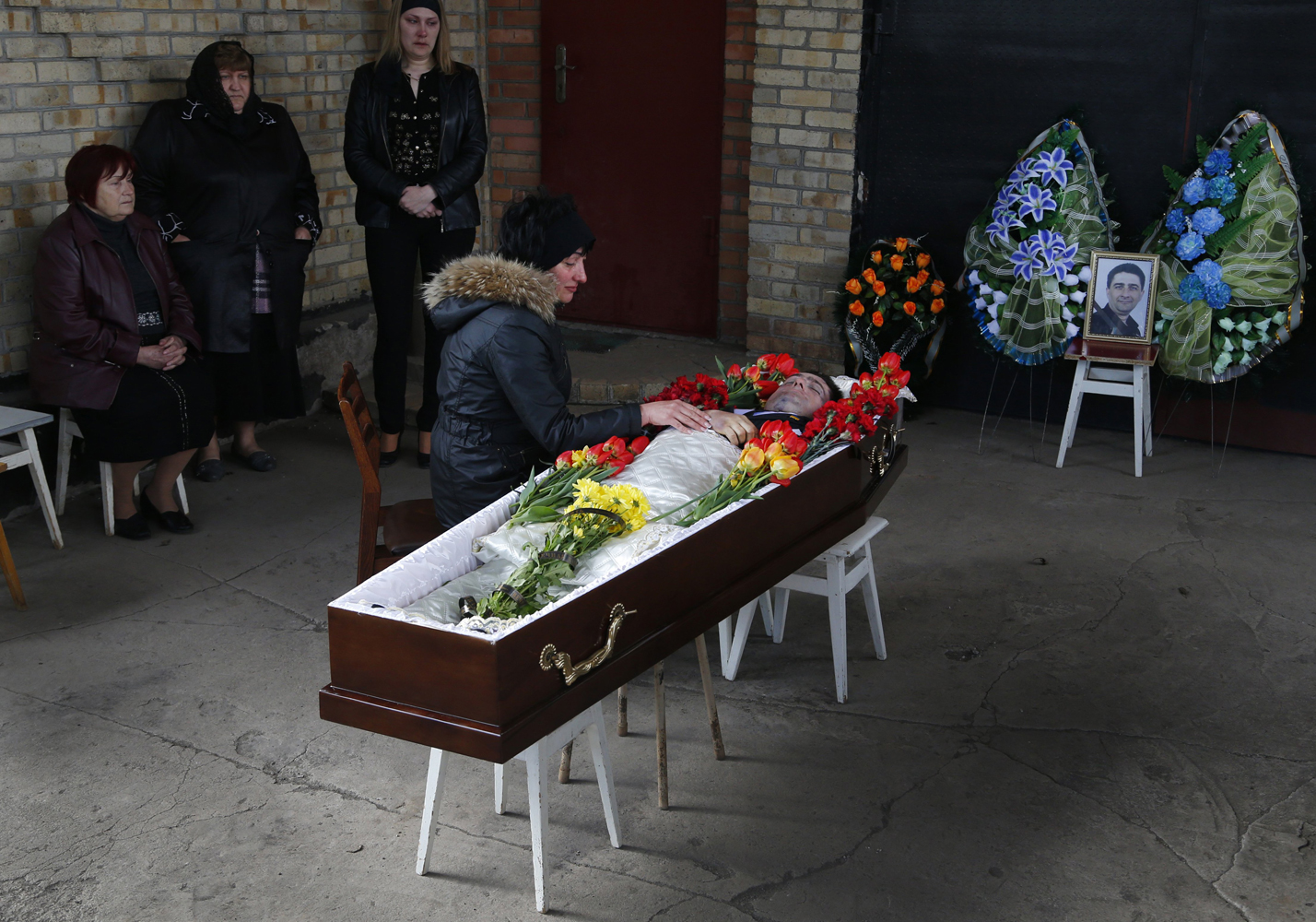 Apr. 24, 2014. The body of Ukrainian councilman Volodymyr Rybak lies in the coffin prior to his funeral after his body was found on Tuesday after his alleged abduction by pro-Russian insurgents in the eastern city of Horlivka, Ukraine.