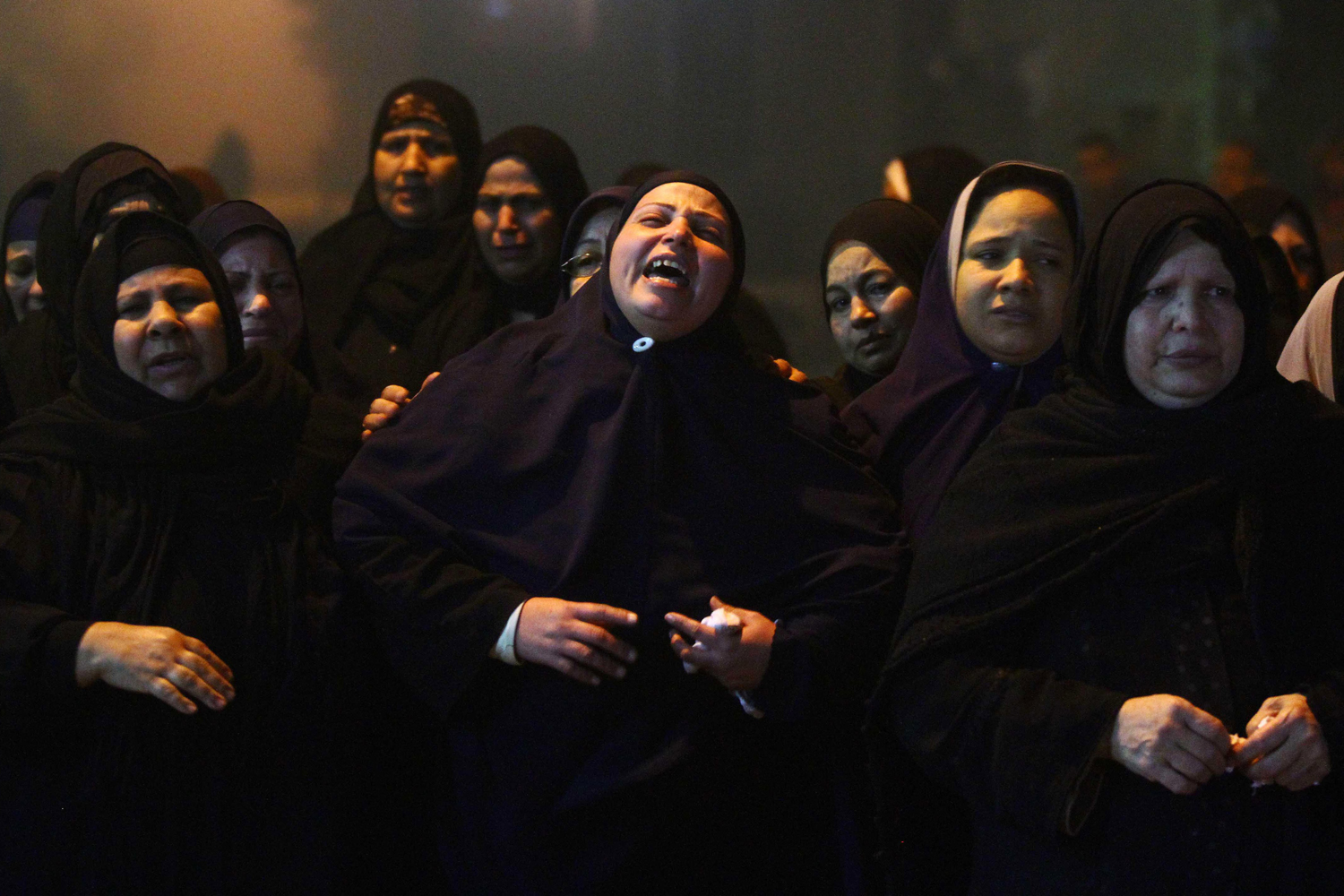 Mar. 29, 2014. Relatives of 22 year-old journalist Mayada Ashraf, who was killed during clashes between Egyptian police and Muslim Brotherhood supporters, mourn during her funeral in El-Monofiya, north of Cairo, Egypt.