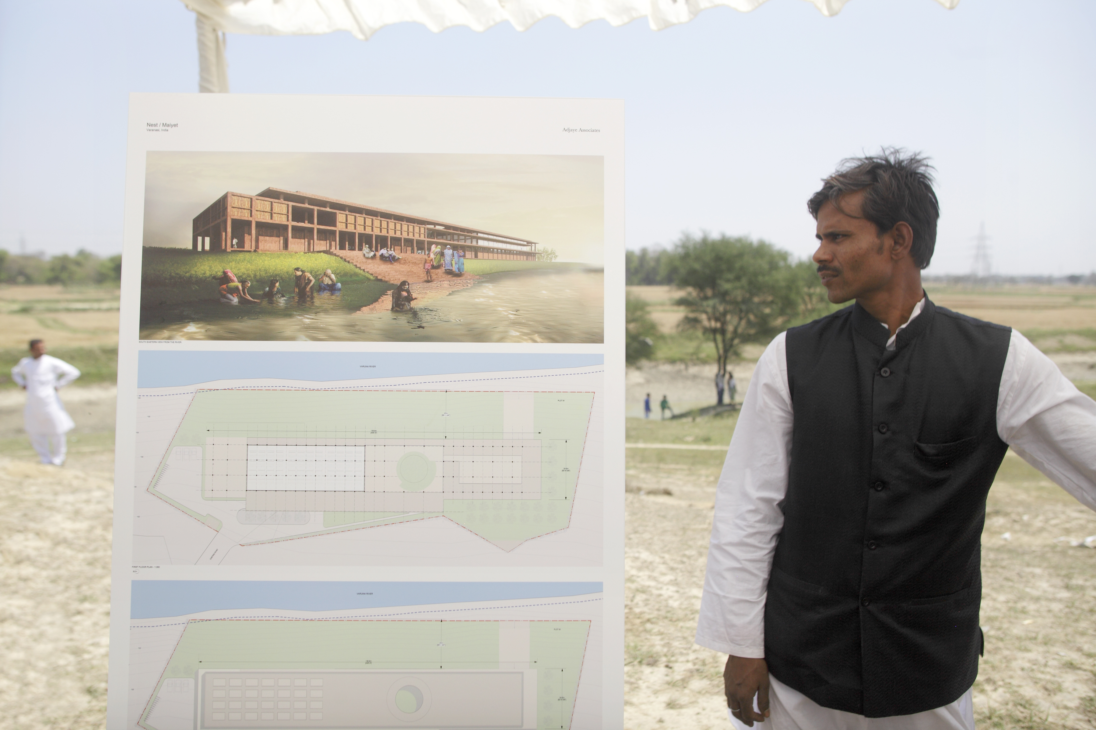 A Varanasi man checks the design proposed by David Adjaye. (Neil Davenport)