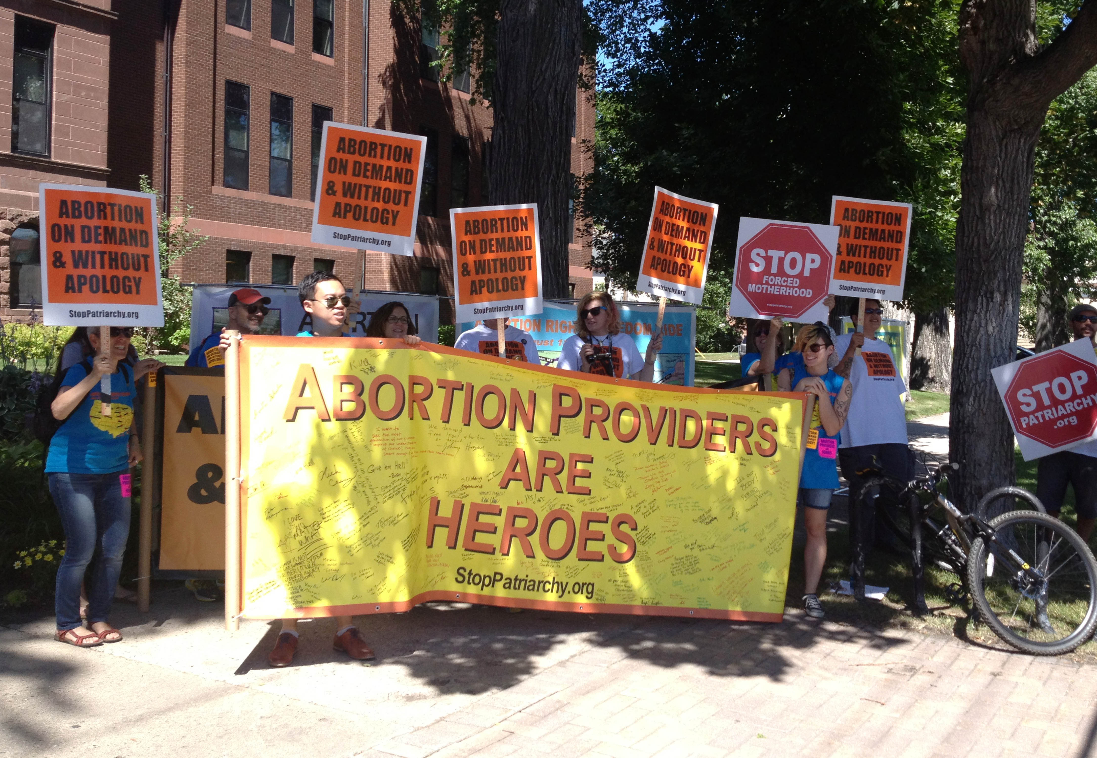 Members of an abortion rights group rally outside the Cass County Courthouse in Fargo, N.D., Wednesday, July 31, 2013. (Dave Kolpack—AP)
