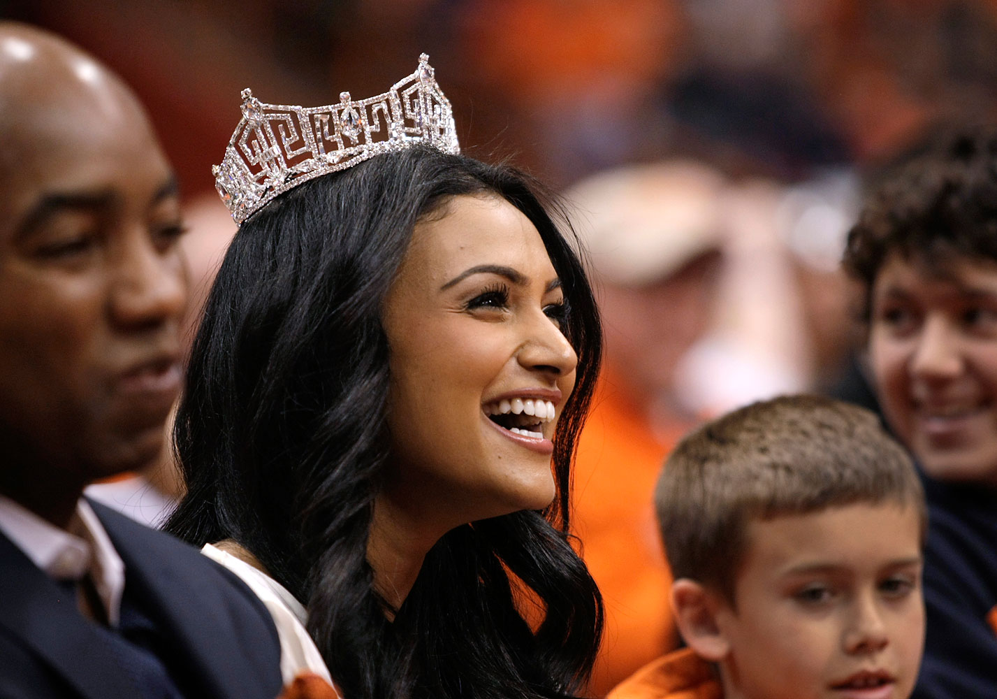 Miss America 2014 Nina Davuluri at a NCAA college basketball game in Syracuse, N.Y., Feb. 15, 2014. A Pennsylvania high school student was suspended for asking Davuluri to prom during a question and answer session at school. (Nick Lisi—AP)