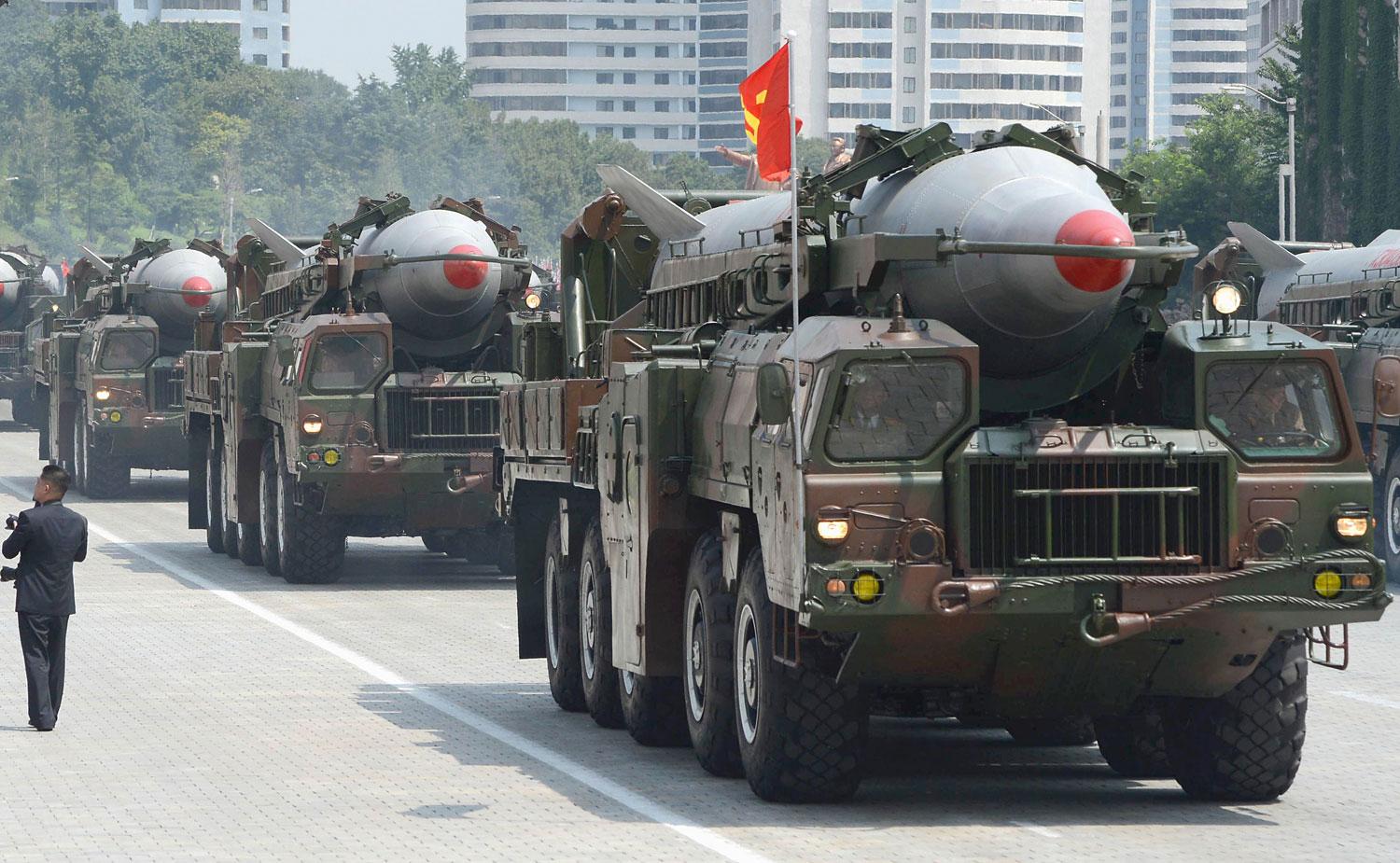 In this July, 2013 photo, military trucks carry Rodong missiles during a military parade at Kim Il Sung Square in Pyongyang. (Kyodo News/AP)