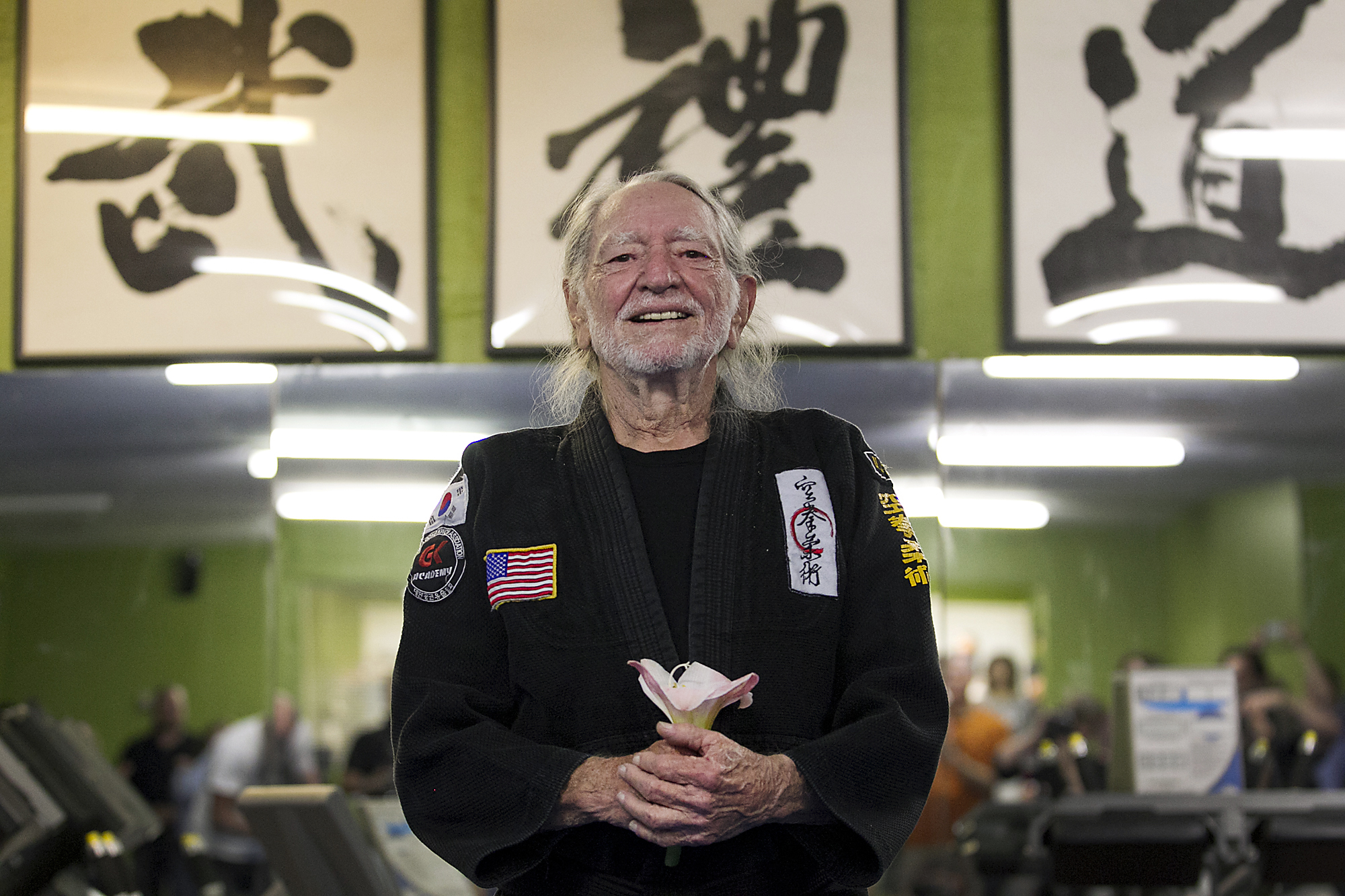 Willie Nelson, the country music icon who turns 81 this week, smiles as he receives his fifth-degree black belt in the martial art of Gong Kwon Yu Sul on Monday, April 28, 2014, in Austin, Texas. (Ralph Barrera / AP)