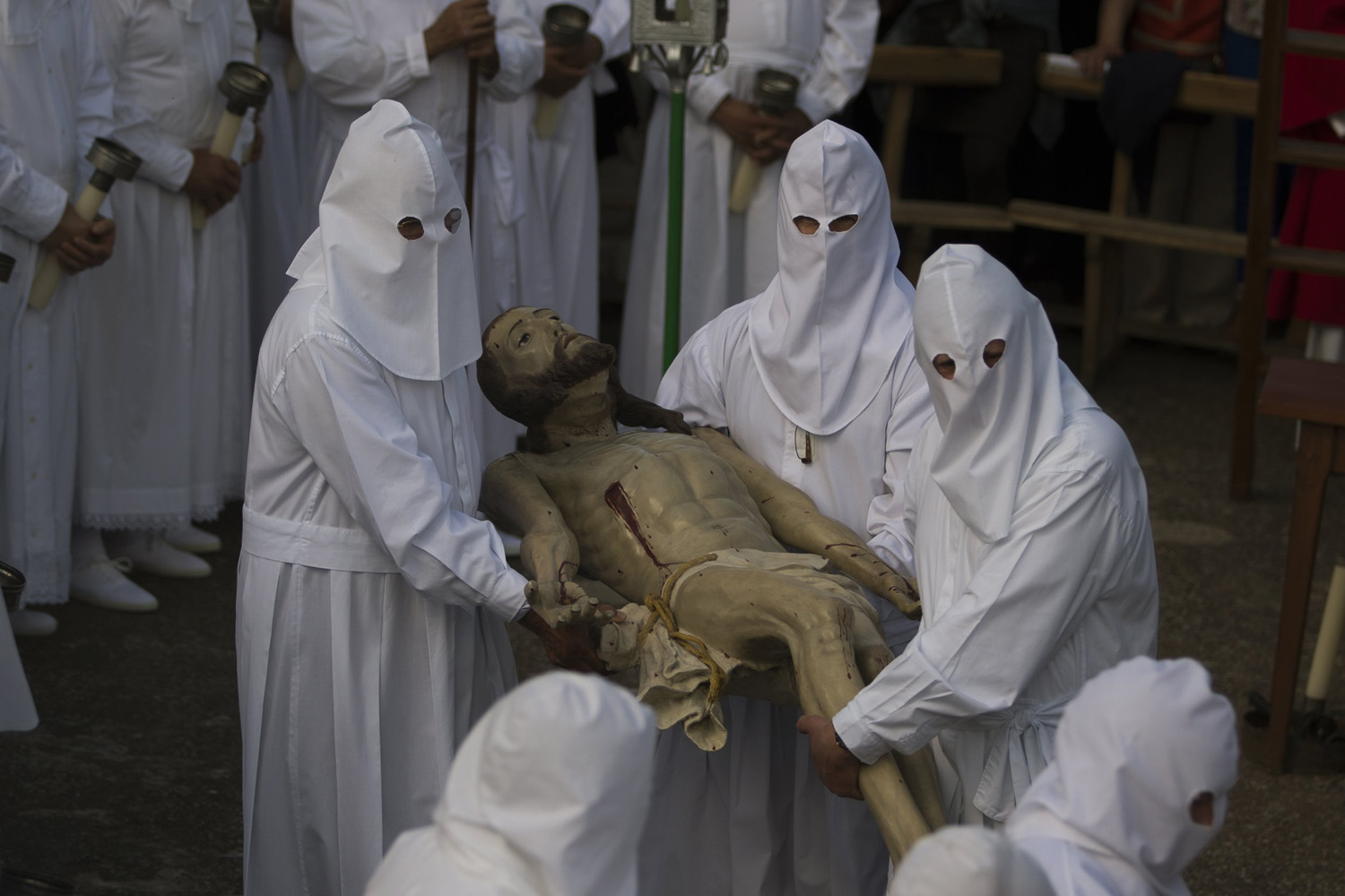 Penitents take part in a procession of  Santo Cristo  during the Holy Week in Bercianos de Aliste, northern Spain, Friday, April 18, 2014.