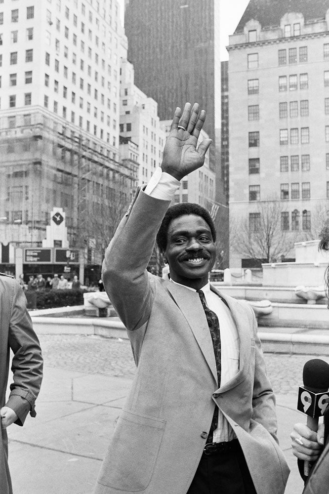 Former middleweight boxing contender Rubin  Hurricane  Carter waves and celebrates on the street after receiving his release from the New Jersey prison system in New York City after his conviction was overturned, Feb. 29, 1988.