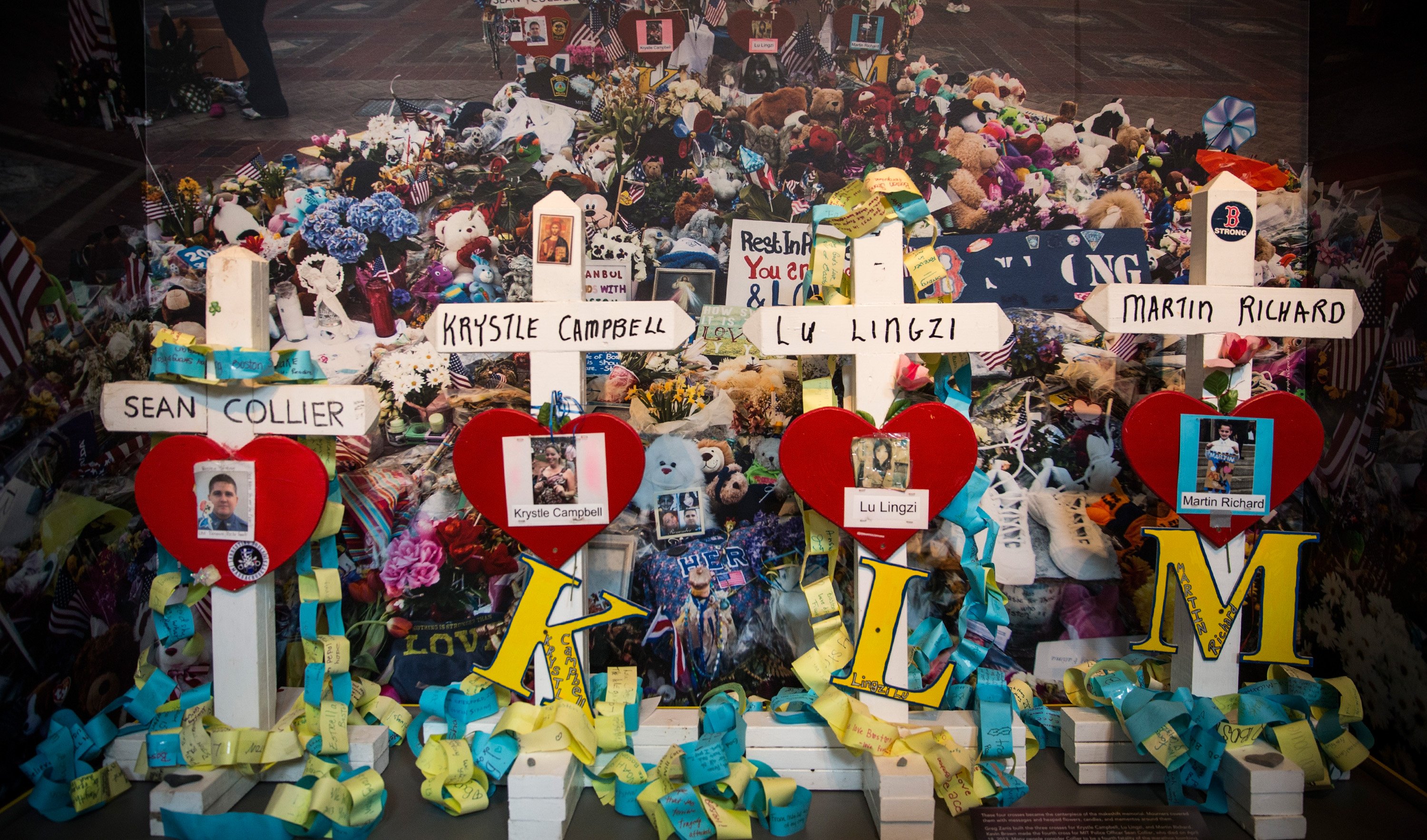Crosses bearing the names of victims of the 2013 Boston Marathon bombing are displayed in a memorial at the Boston Public Library on April 14, 2014 in Boston. (Andrew Burton—Getty Images)